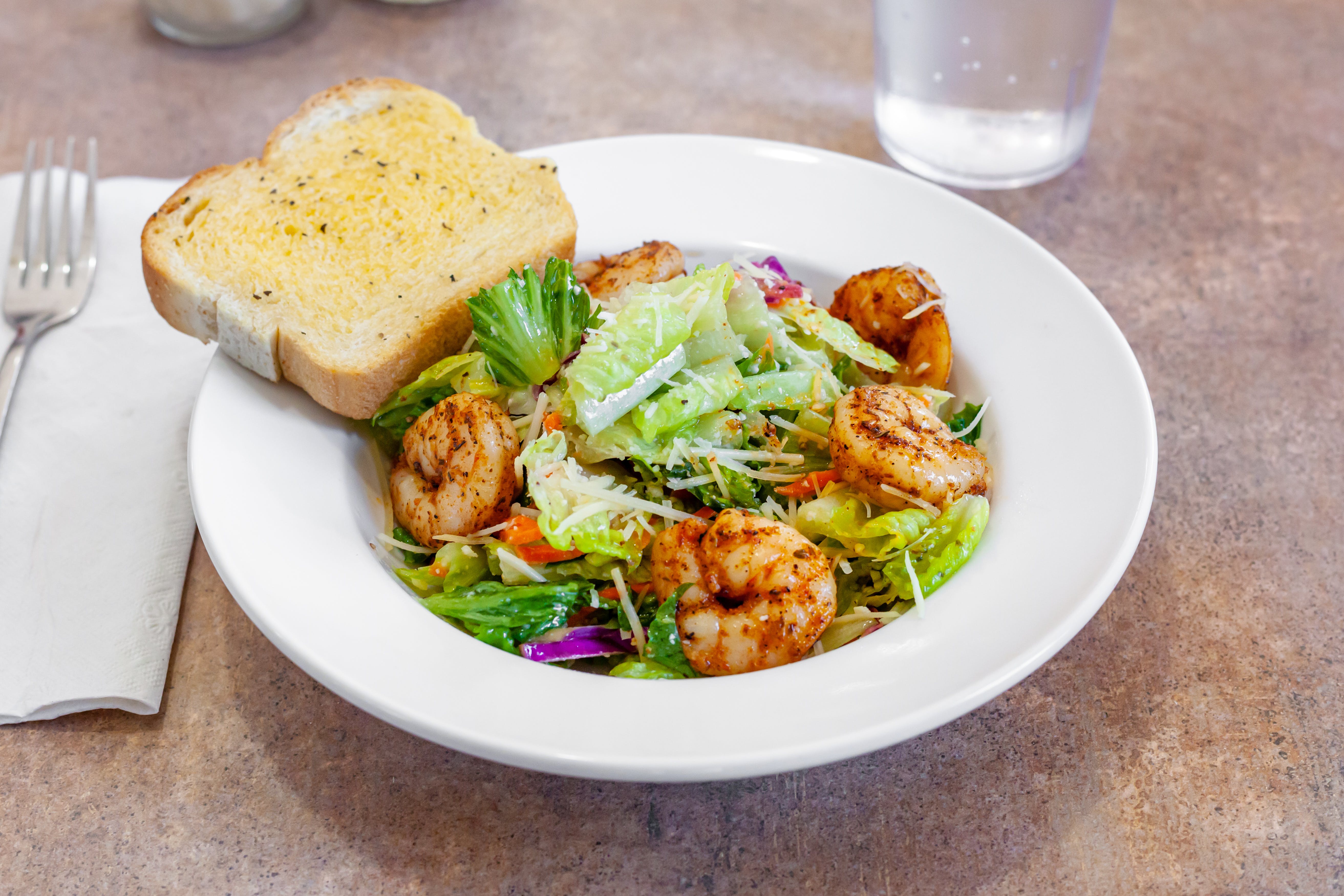 Order Our Famous Salad with Sauteed Shrimp - Small food online from Pasta Jack's store, Benton on bringmethat.com