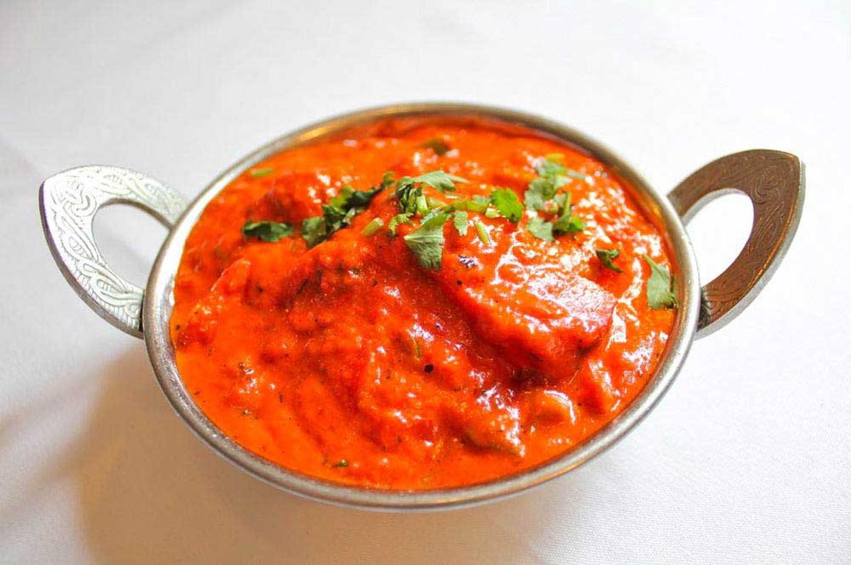 Order Butter chicken + GARLIC NAN food online from India Quality Restaurant store, Boston on bringmethat.com