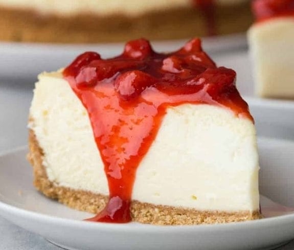 Order Cheese cake with strawberry topping food online from Las Brasas Charcoal Chicken store, Houston on bringmethat.com