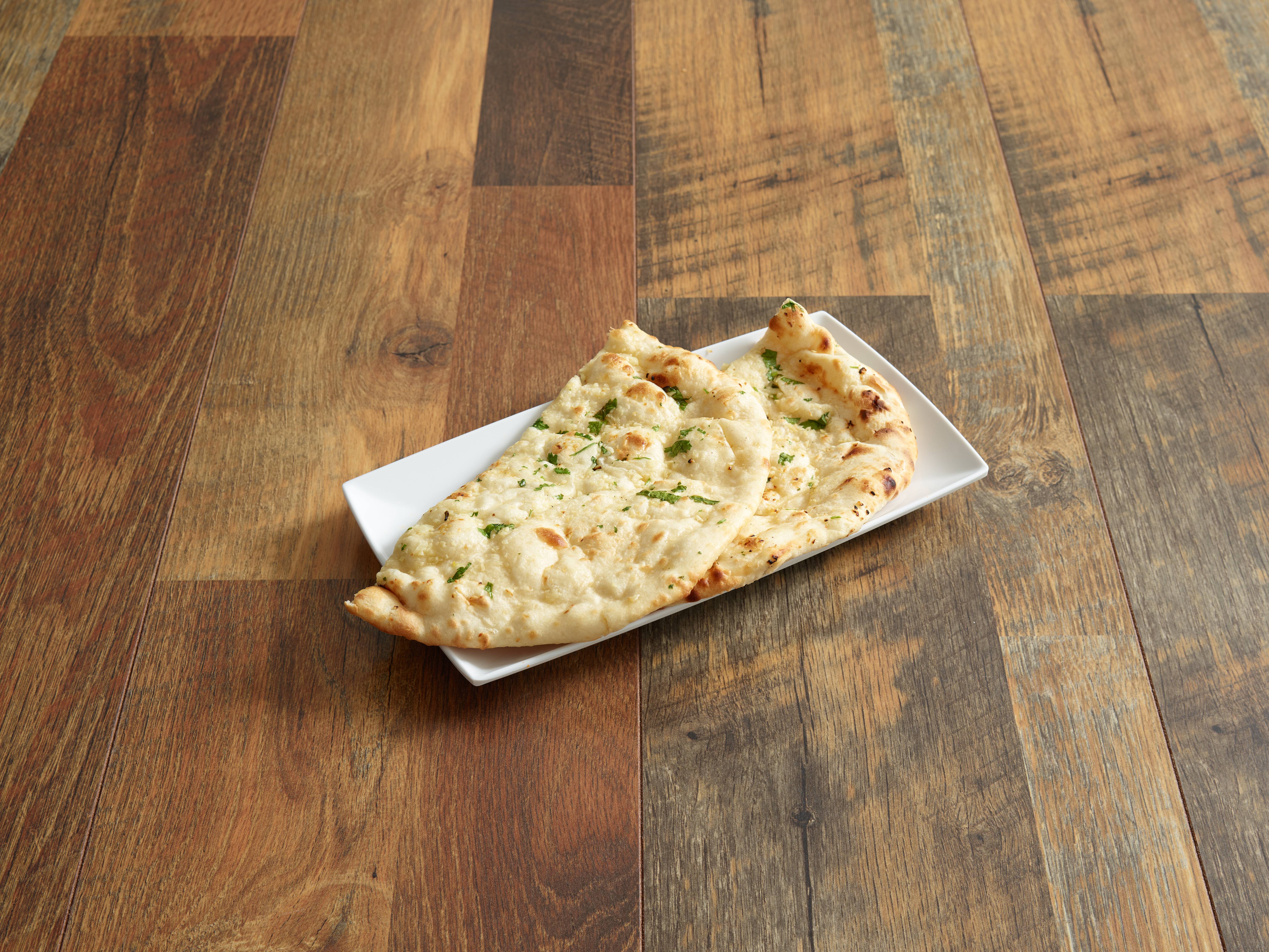 Order Garlic Naan food online from Indian Grill store, Camillus on bringmethat.com
