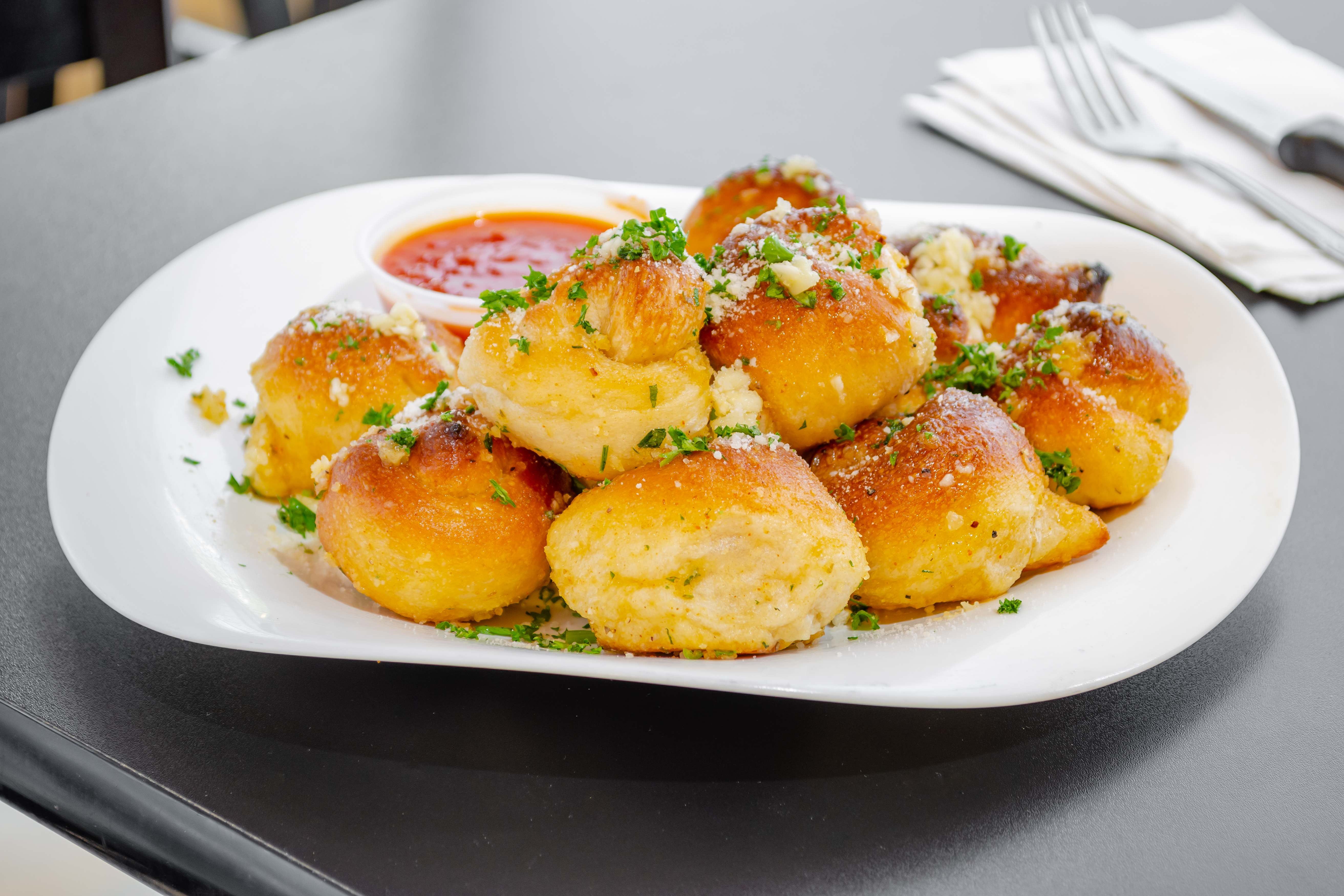 Order Garlic Knots - 6 Pieces food online from Brooklyn Pizza store, Stirling on bringmethat.com