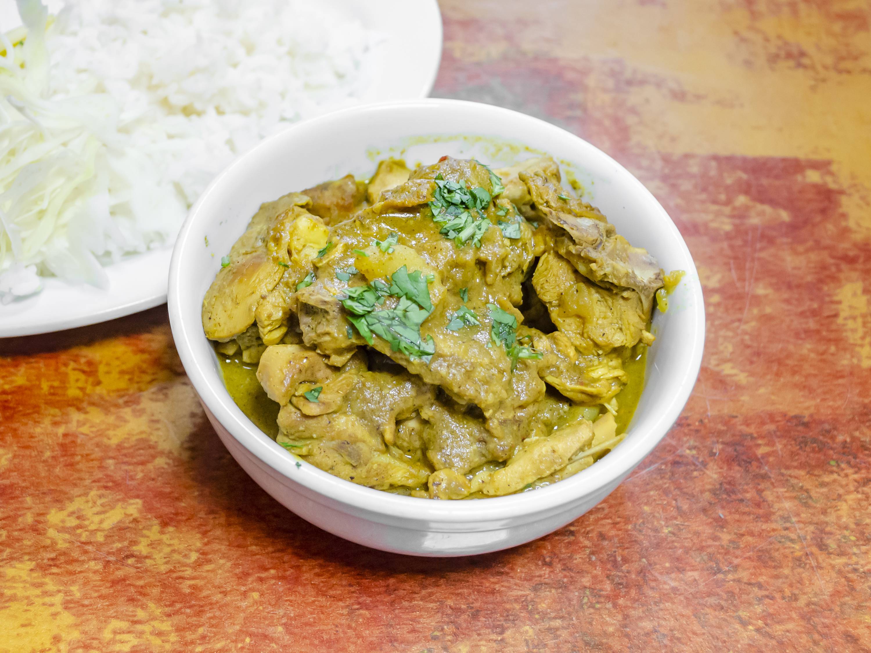 Order Chicken Curry food online from Coconut Palm Bar & Grill store, Bronx on bringmethat.com