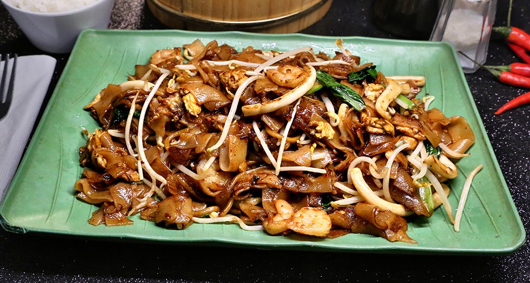 Order N16. Fried Koay Teow food online from Singapore Cafe store, Sugar Land on bringmethat.com