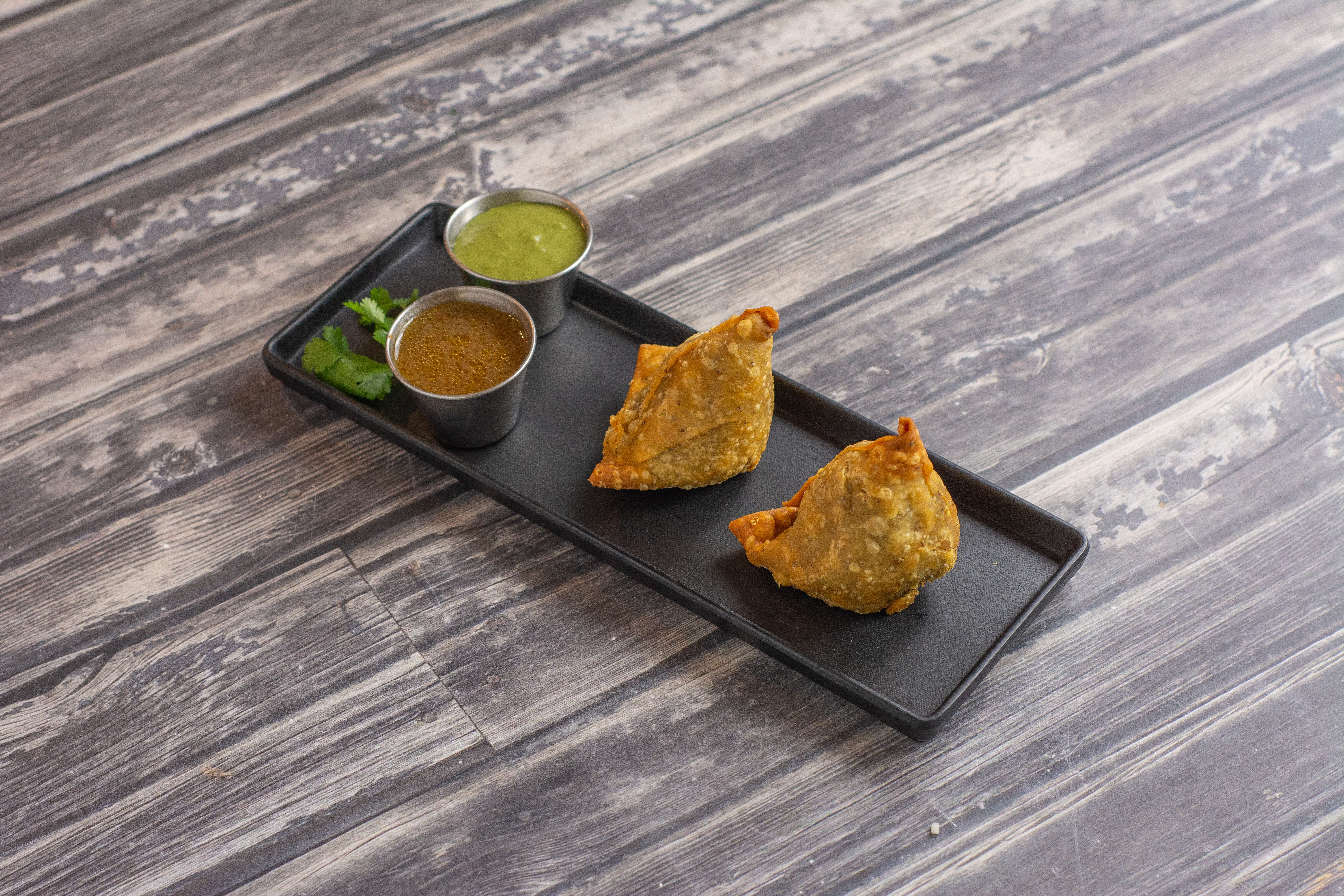 Order 2 Pieces Veggie Samosa food online from Swaad Indian Cuisine store, San Jose on bringmethat.com