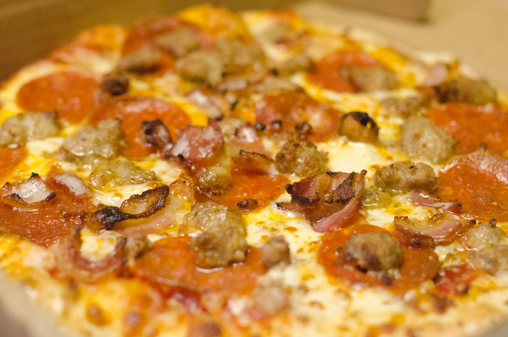 Order Meat Lovers Pizza food online from Leonore Restaurant store, Roanoke on bringmethat.com