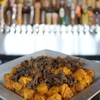Order PHILLY CHEESE TOTS food online from Players Sports Bar store, Poway on bringmethat.com