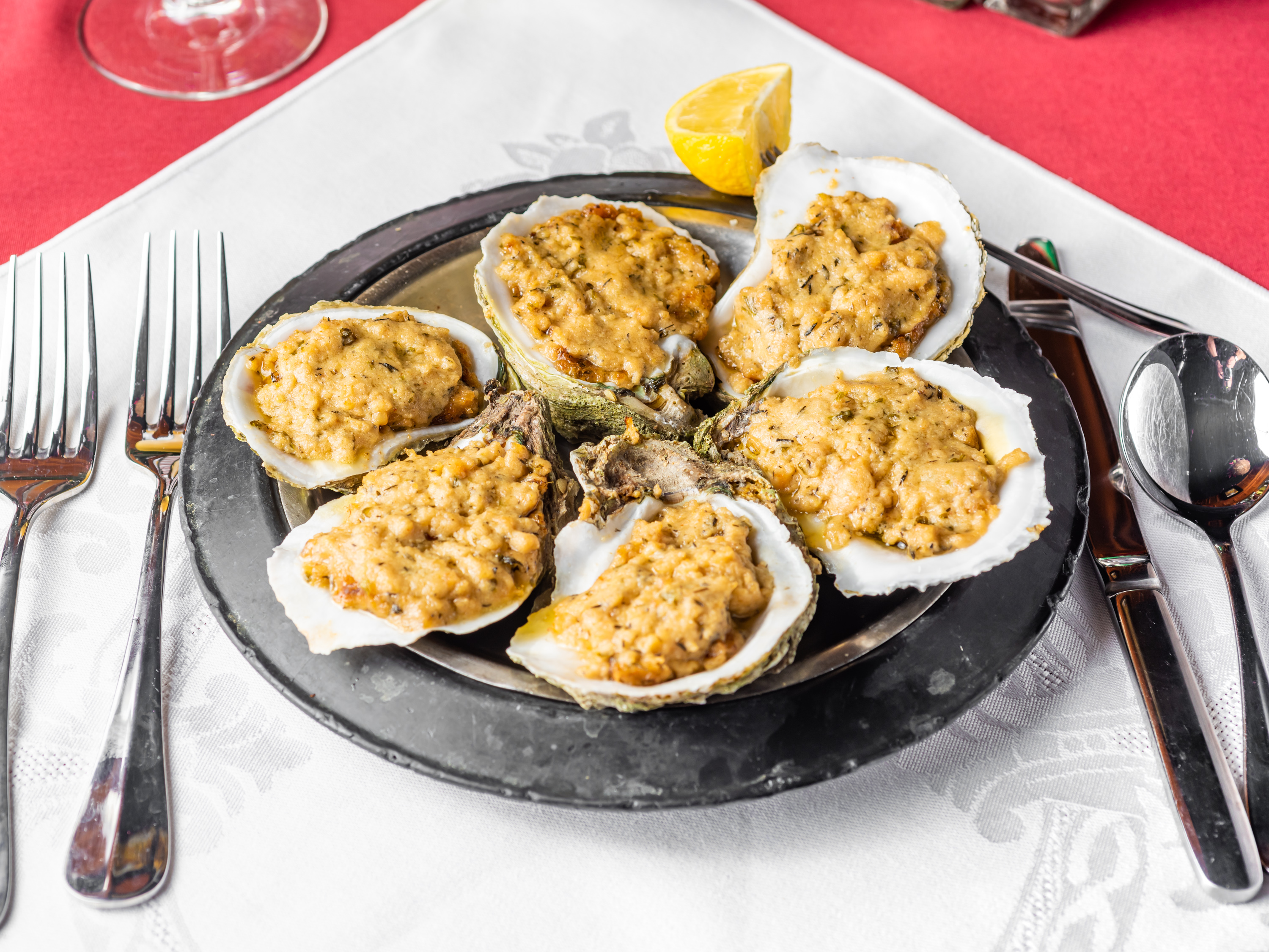 Order 1/2 Dozen of Oysters Bienville food online from Poorboy's Riverside Inn store, Broussard on bringmethat.com