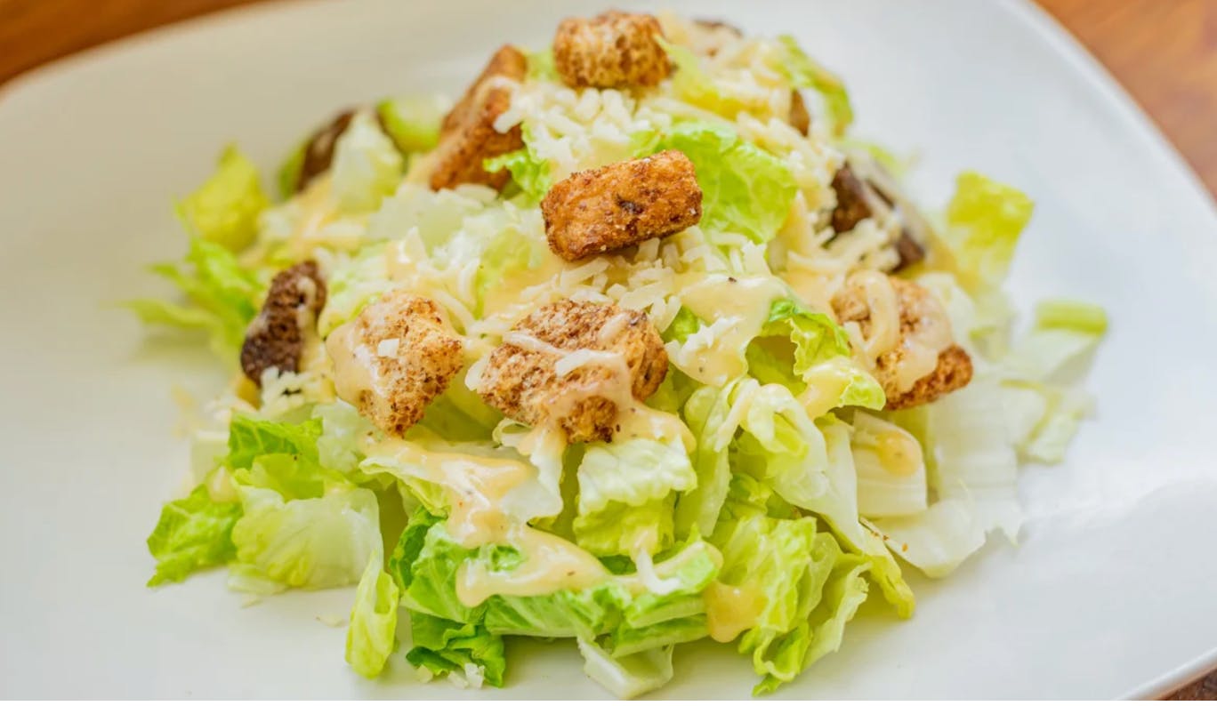Order Caesar Salad - Salads food online from Yummy Pizza store, San Francisco on bringmethat.com