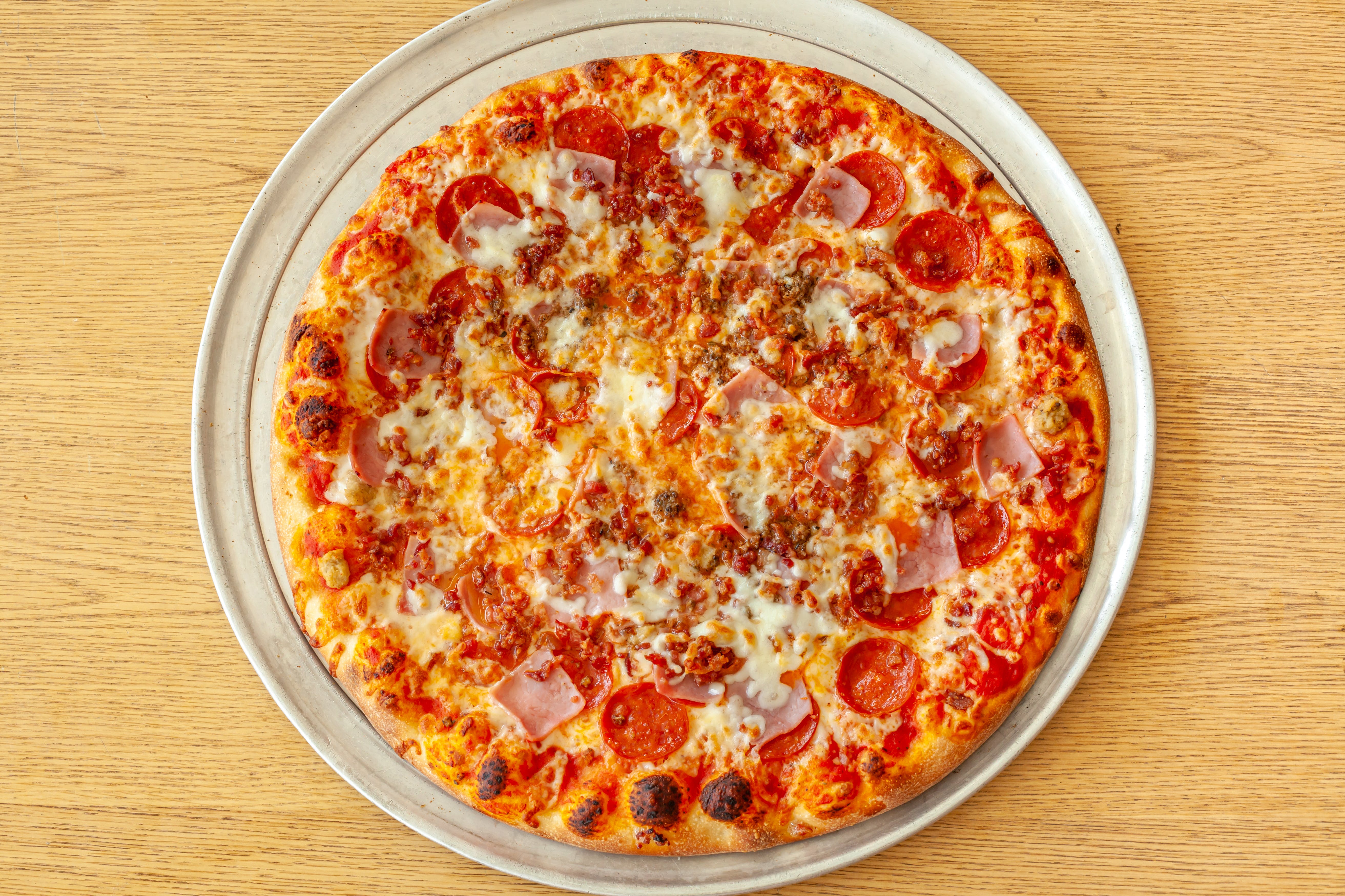 Order Meat Lover's Pizza - Mini 10" food online from Rosa Italian Pizza & Restaurant store, Powhatan on bringmethat.com