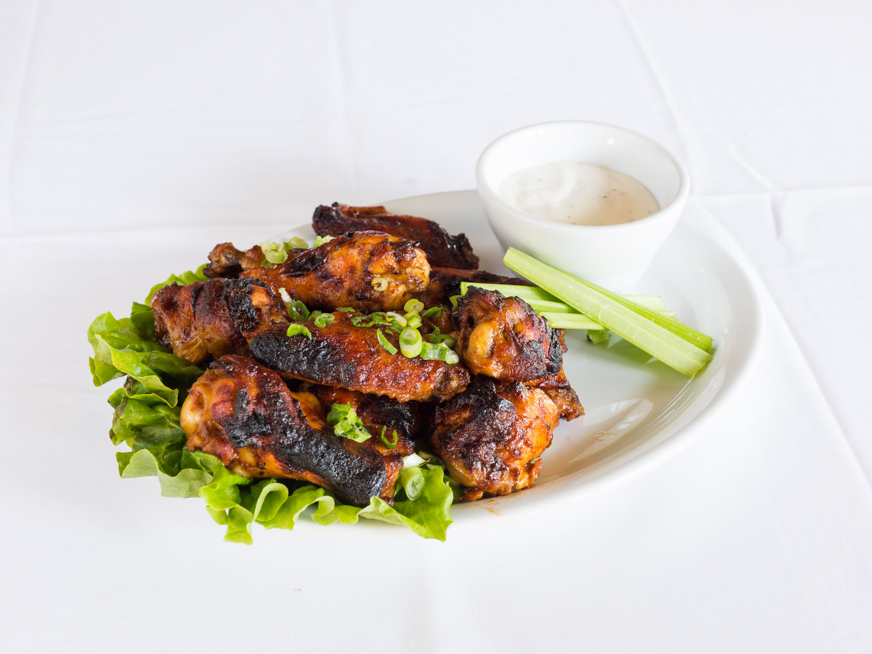 Order Wood-Fired Wings food online from Trio A Brick Oven Cafe store, Greenville on bringmethat.com