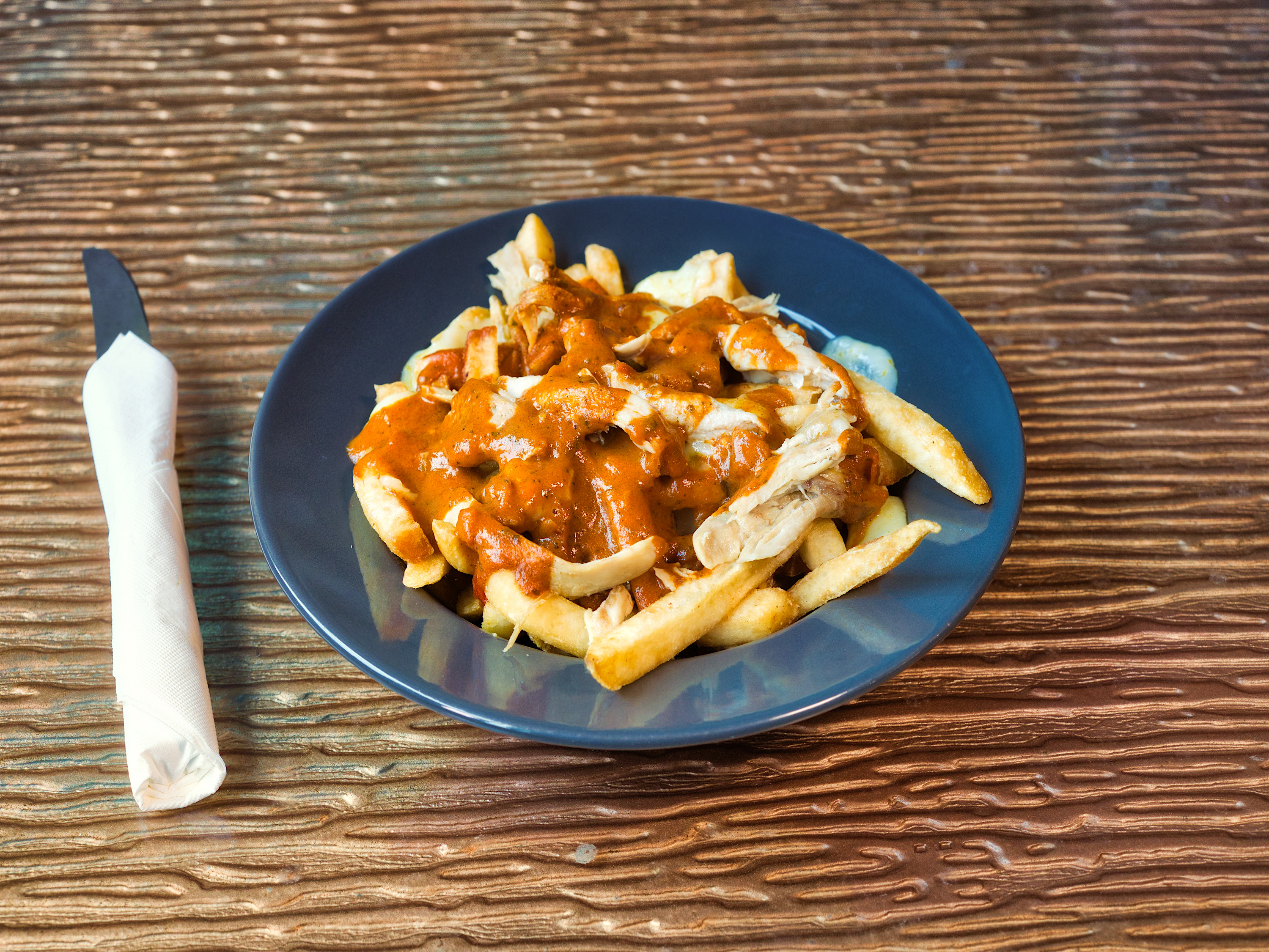 Order Bombay You Stay - Poutine food online from Liberty Bar & Poutinerie store, Pontiac, MI on bringmethat.com