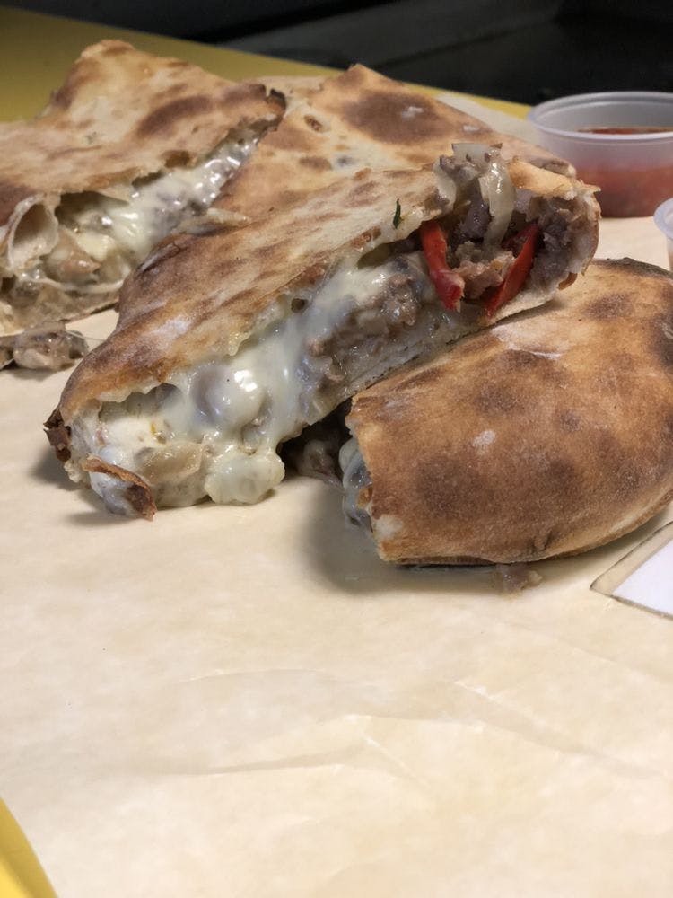 Order 4- Steak & Cheese Calzone - Small 13" (Half) food online from Mamma Lisa's Pizzeria store, Somerville on bringmethat.com