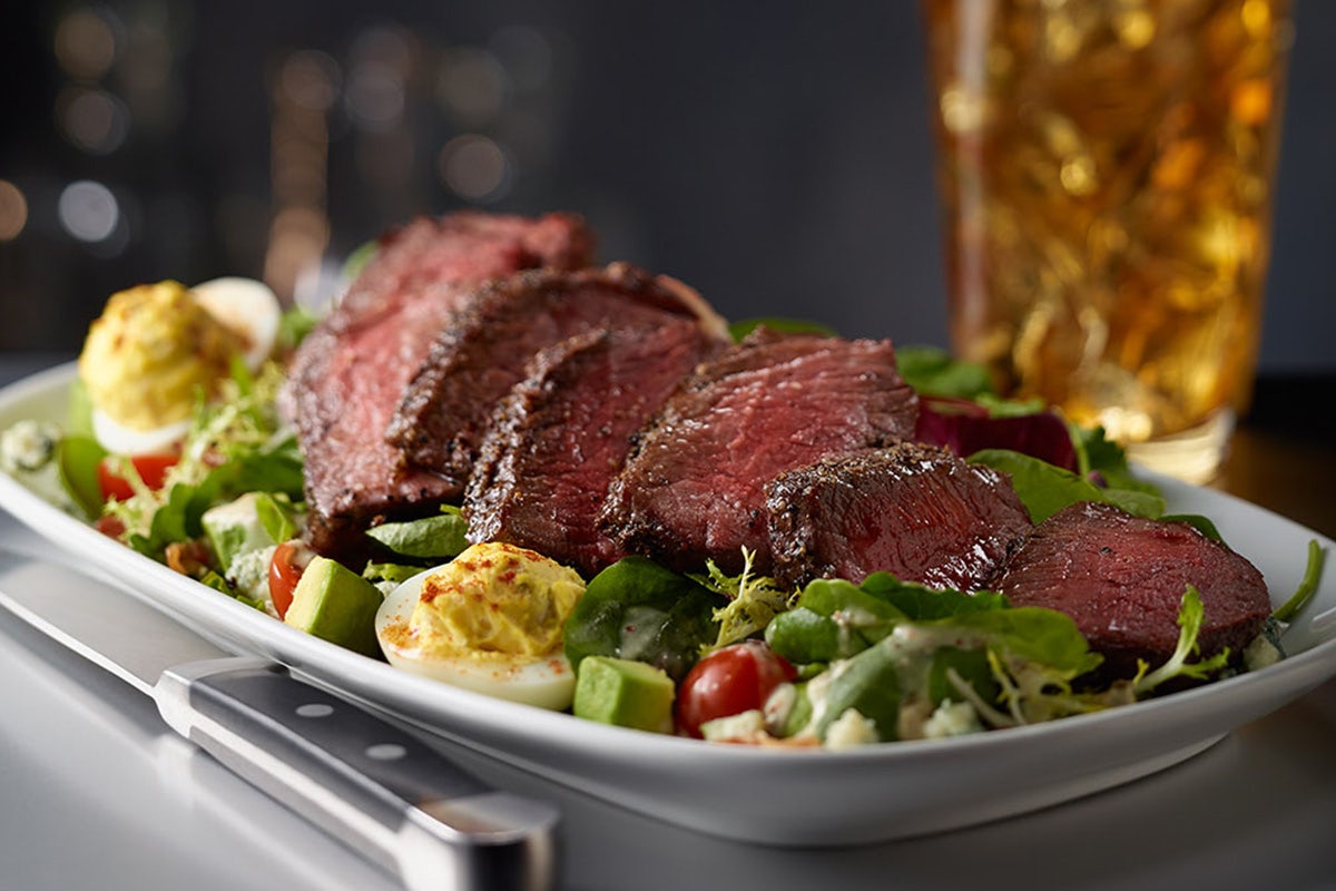 Order STEAKHOUSE SALAD WITH STEAK food online from Sullivan's store, Indianapolis on bringmethat.com