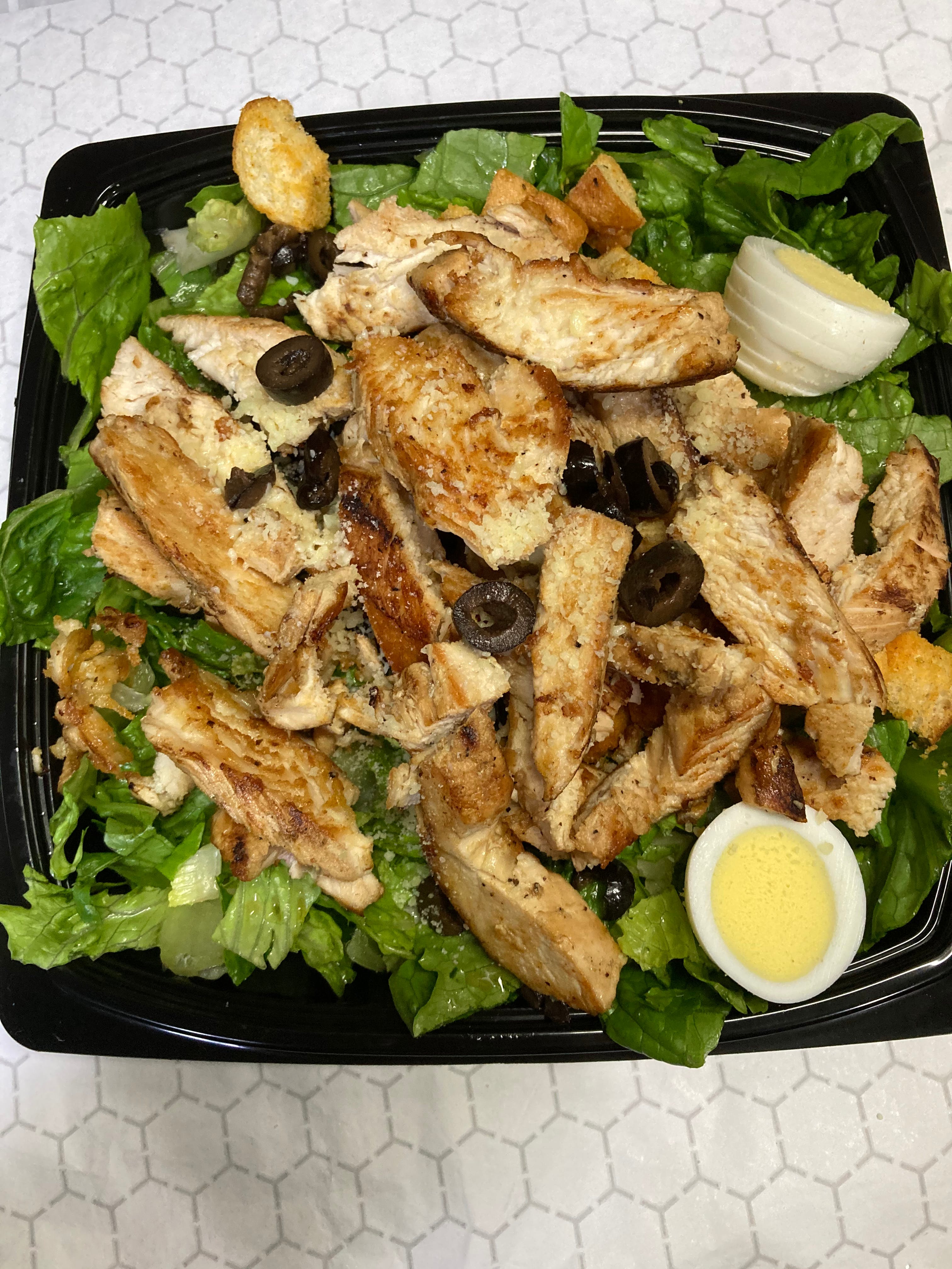 Order Grilled Chicken Caesar Salad - Salad food online from Evans Pizza & Restaurant store, Philadelphia on bringmethat.com