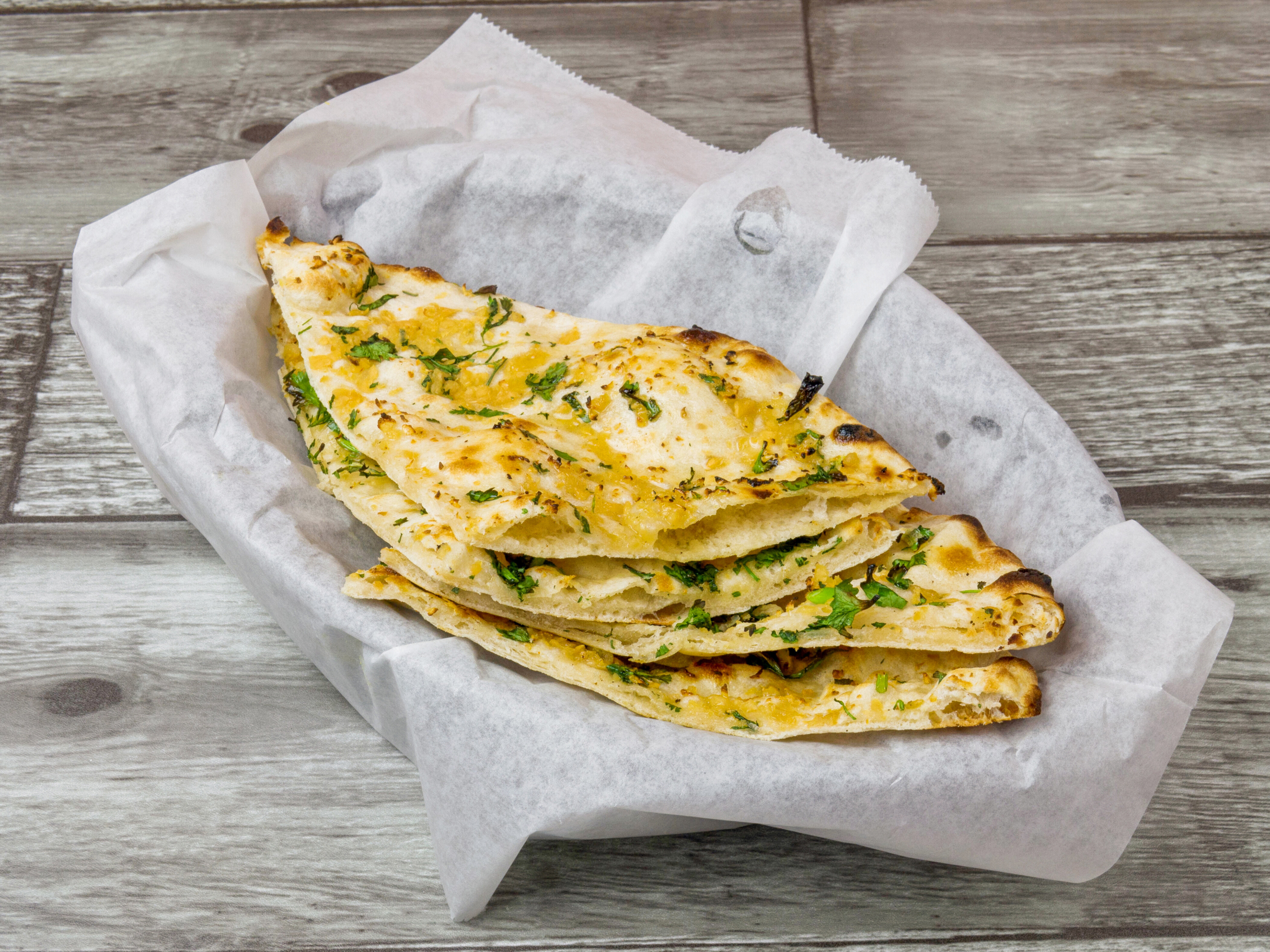 Order Garlic Naan food online from Bombay Palace Indian Restaurant store, Katy on bringmethat.com