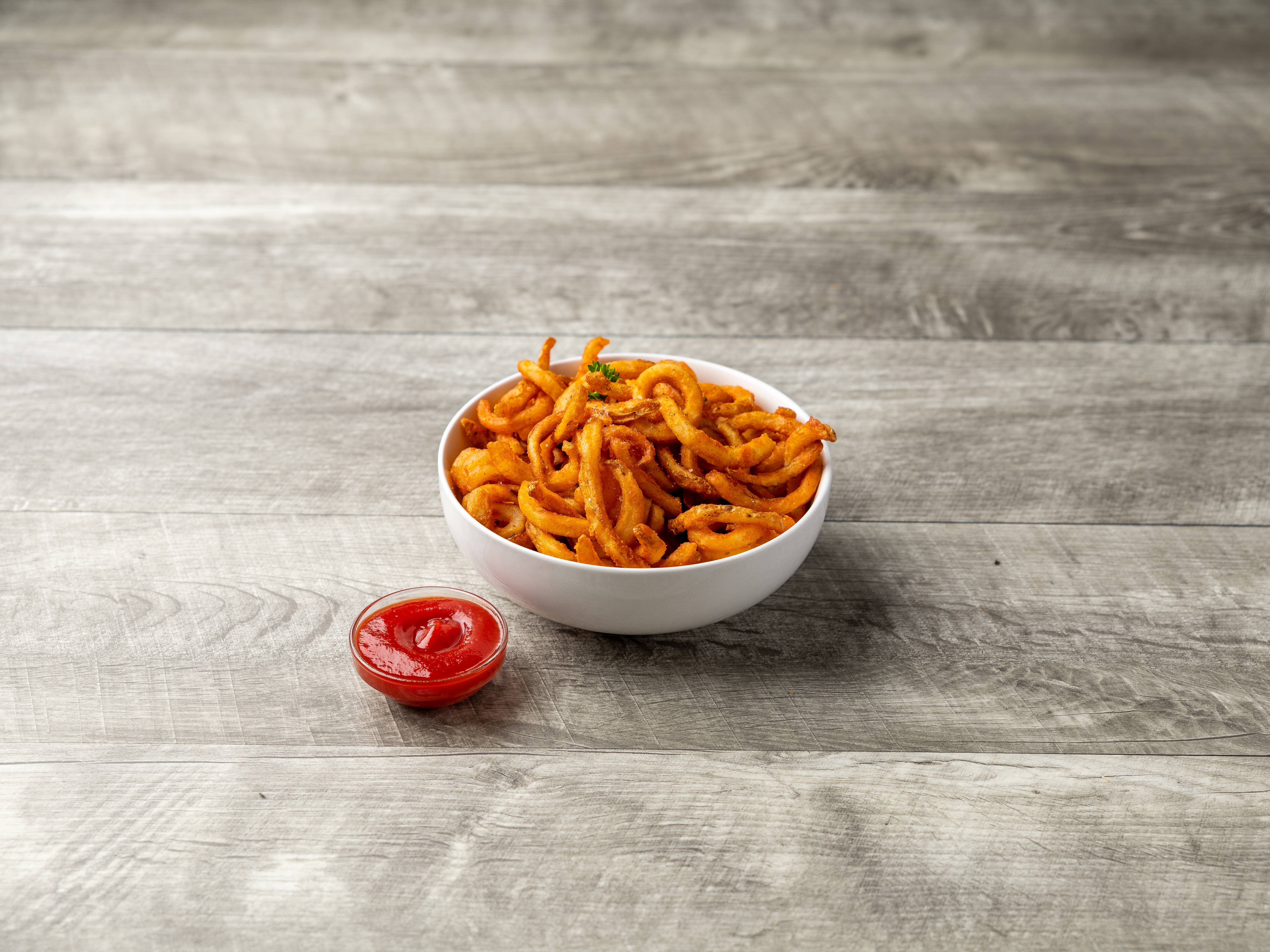 Order Curly Fries food online from Slices Pizza store, Philadelphia on bringmethat.com
