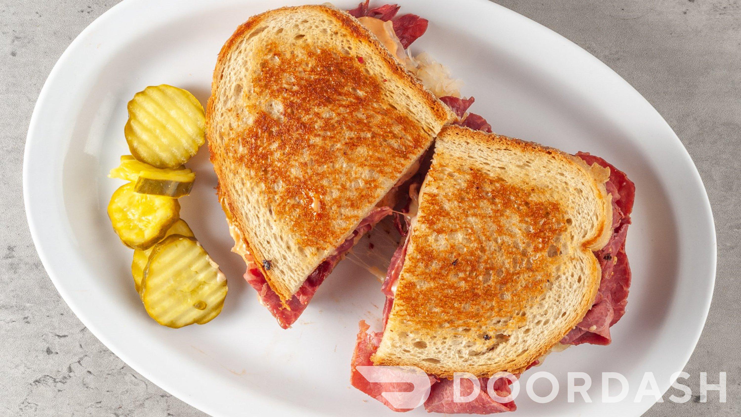 Order Grilled Corned Beef Reuben Sandwich food online from Our Deli & Cafe store, Paoli on bringmethat.com