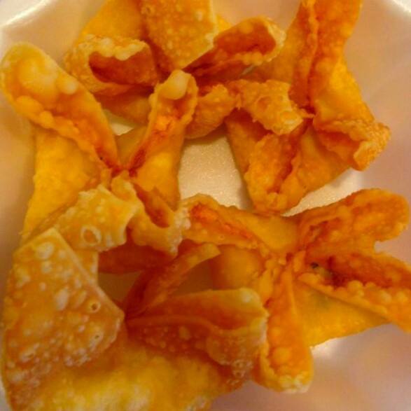 Order 103. Fried Crab Rangoon with Cream Cheese food online from Peking Dragon Chinese Restaurant store, Desoto on bringmethat.com