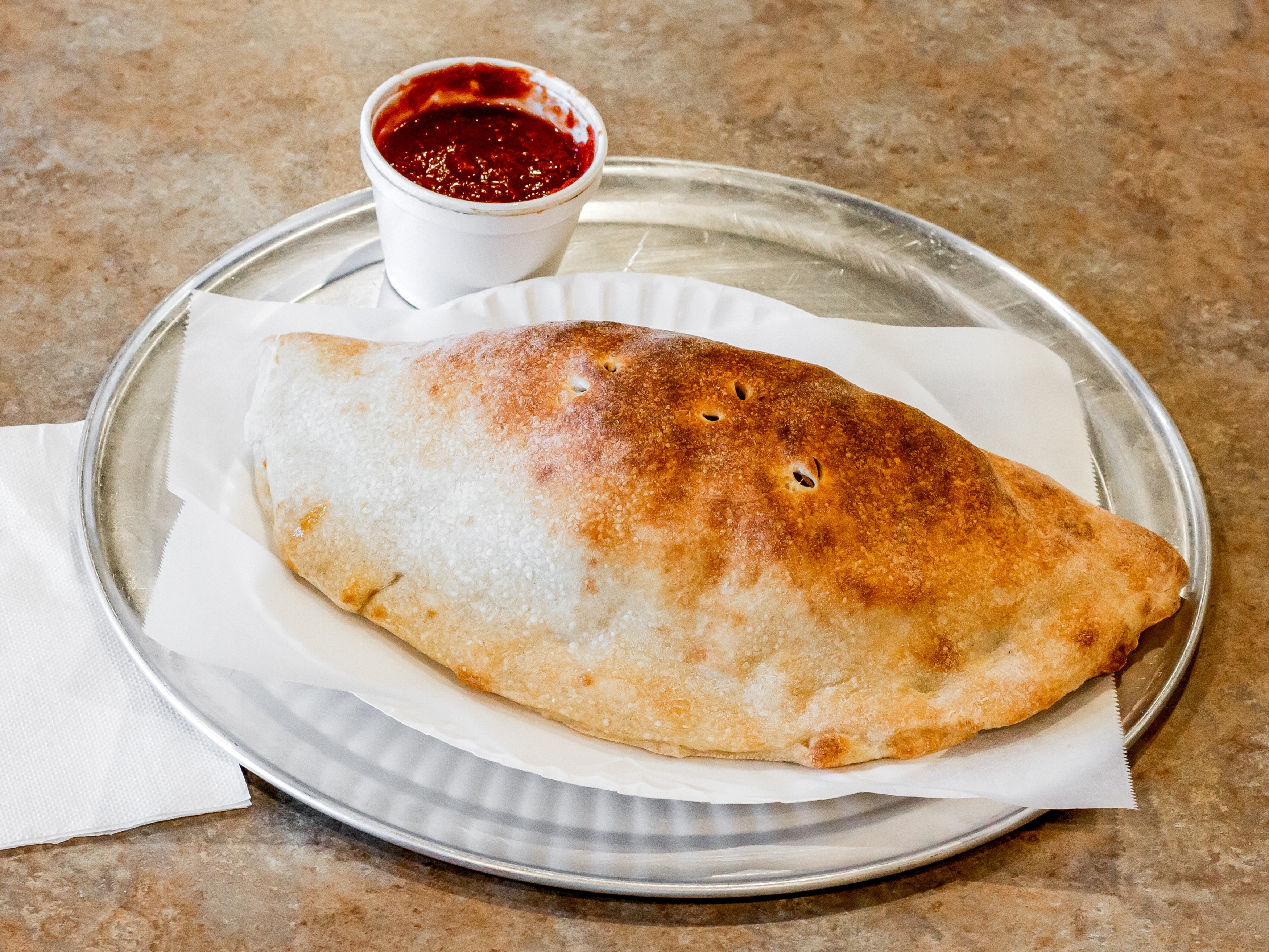 Order Calzone food online from Tony's Pizza store, Jacksonville on bringmethat.com