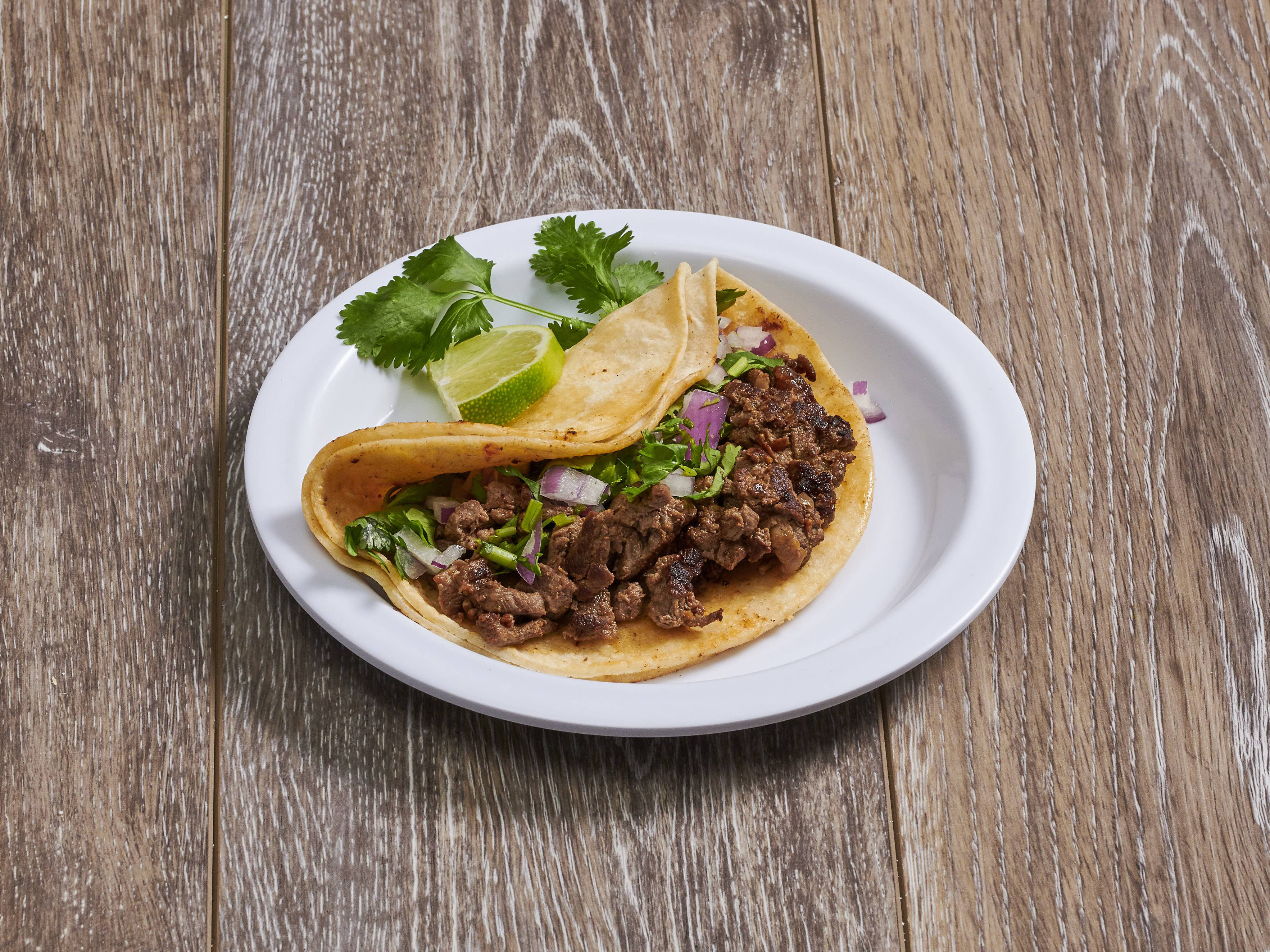 Order Bistec Taco food online from La Comadre Restaurant And Bakery store, Woodhaven on bringmethat.com