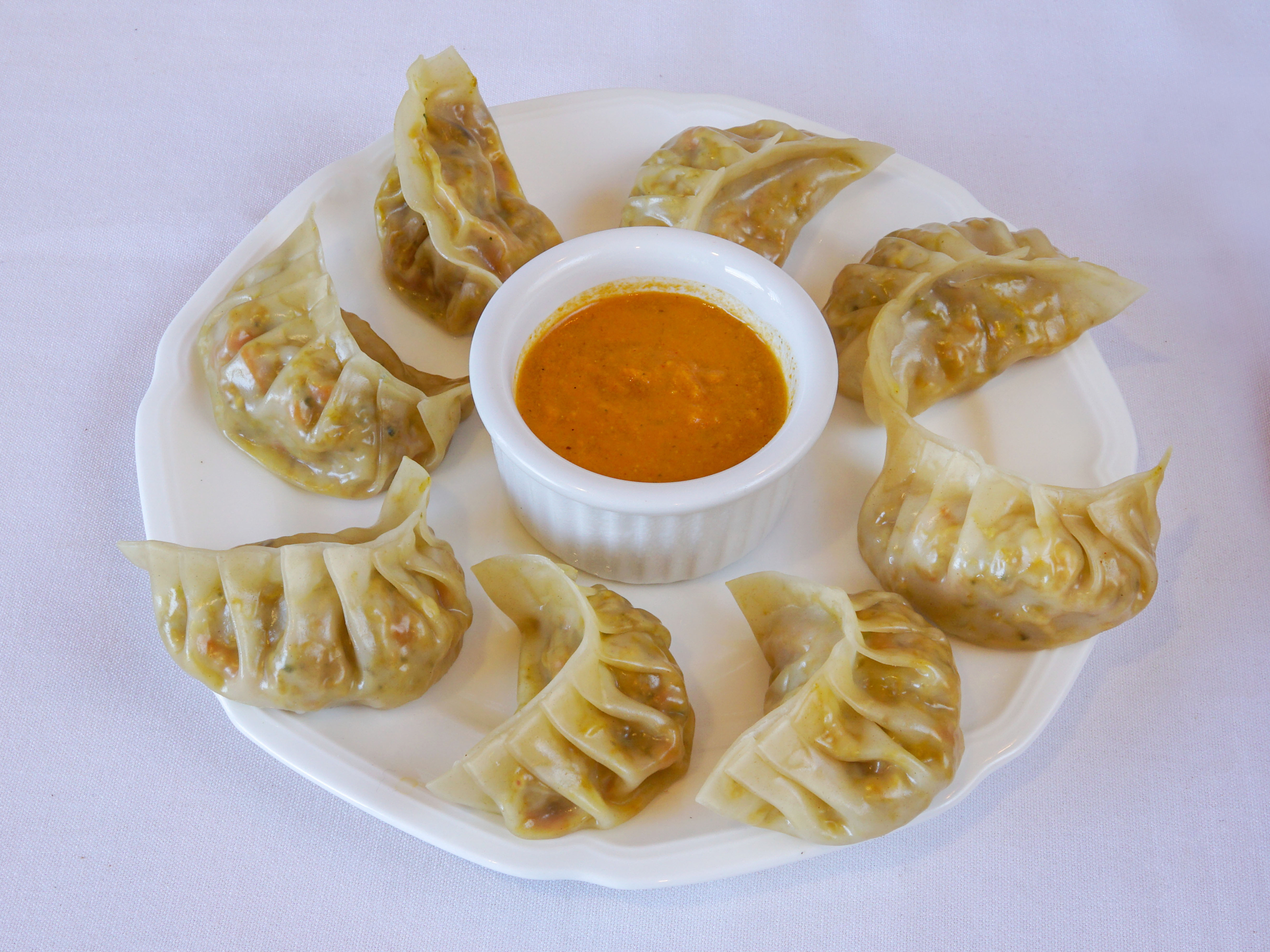 Order 8 Pieces Steamed Momo Vegetable food online from Momo N Curry store, Concord on bringmethat.com