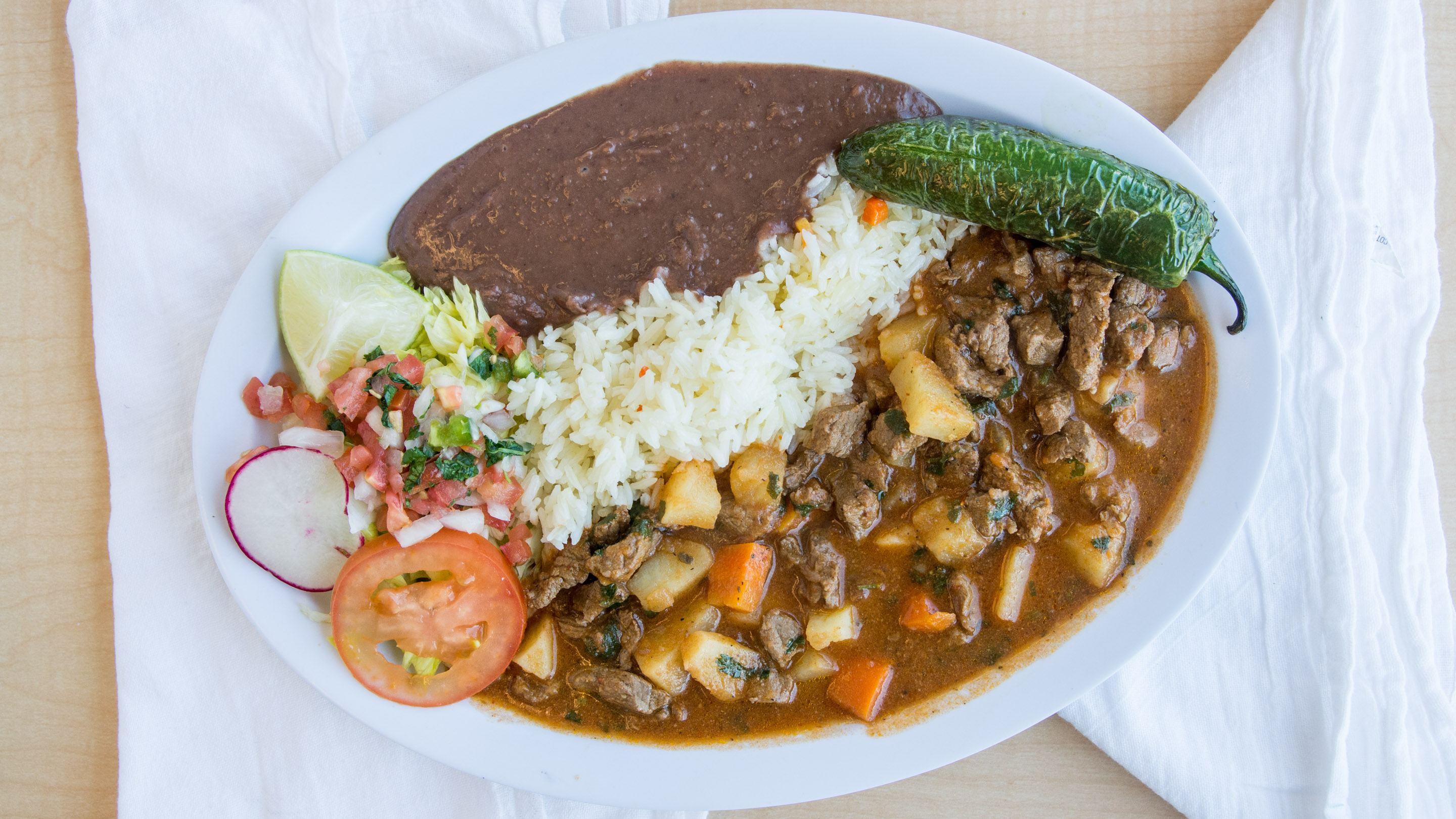 Order Carne Guisada food online from Paradise Restaurant store, Winchester on bringmethat.com