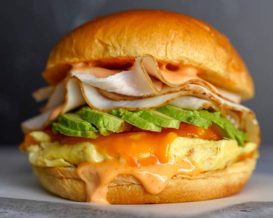 Order Brioche/Croissant, Smoked Turkey, Avocado, Egg, & Cheddar food online from Breakfast in Bed store, Troy on bringmethat.com