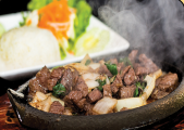 Order 56. Diced Filet Mignon and Onions on Sizzling Plate with Rice food online from Pho Anh store, Riverside on bringmethat.com