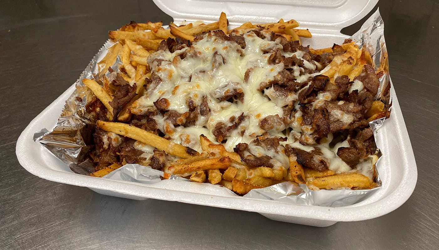 Order Philly Steak French Fries - Fries food online from New York New York Pizza and Pasta store, La Mesa on bringmethat.com