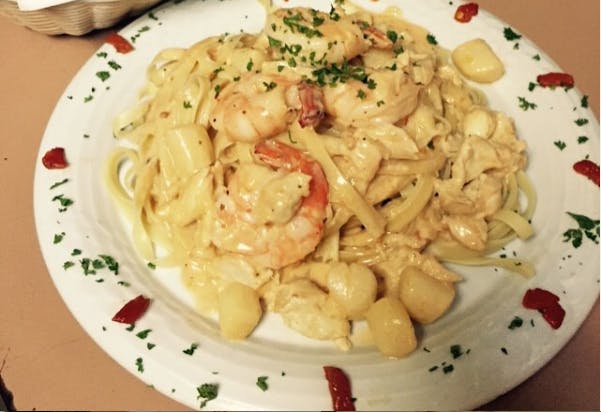 Order Seafood Fettuccini - Entree food online from Godfather Italian Grill store, Mays Landing on bringmethat.com