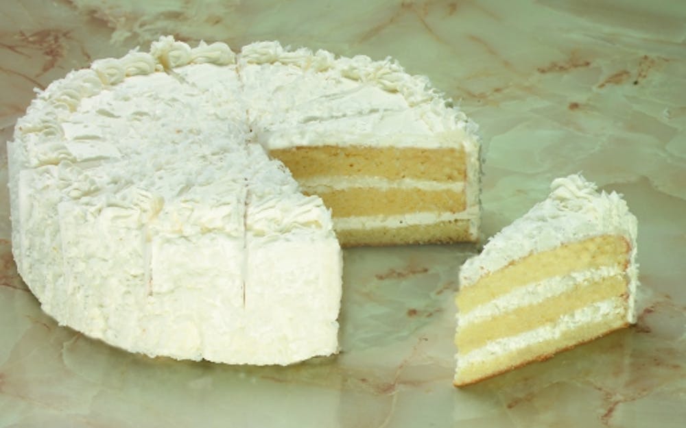 Order Coconut Cake - Dessert food online from Three Brothers Italian Restaurant store, Prince Frederick on bringmethat.com