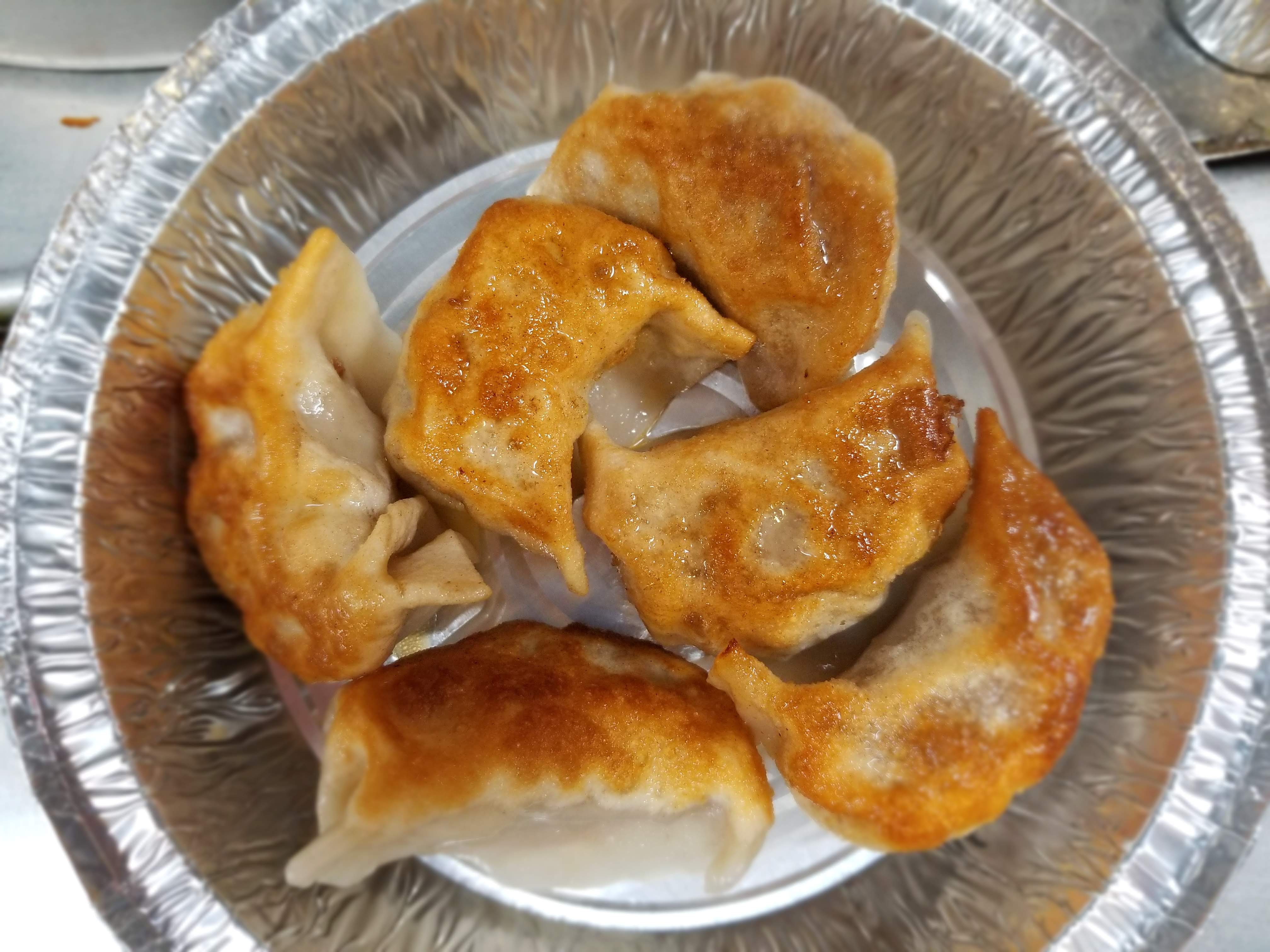 Order 16. Pork Dumplings food online from Jade Palace store, Valley Stream on bringmethat.com