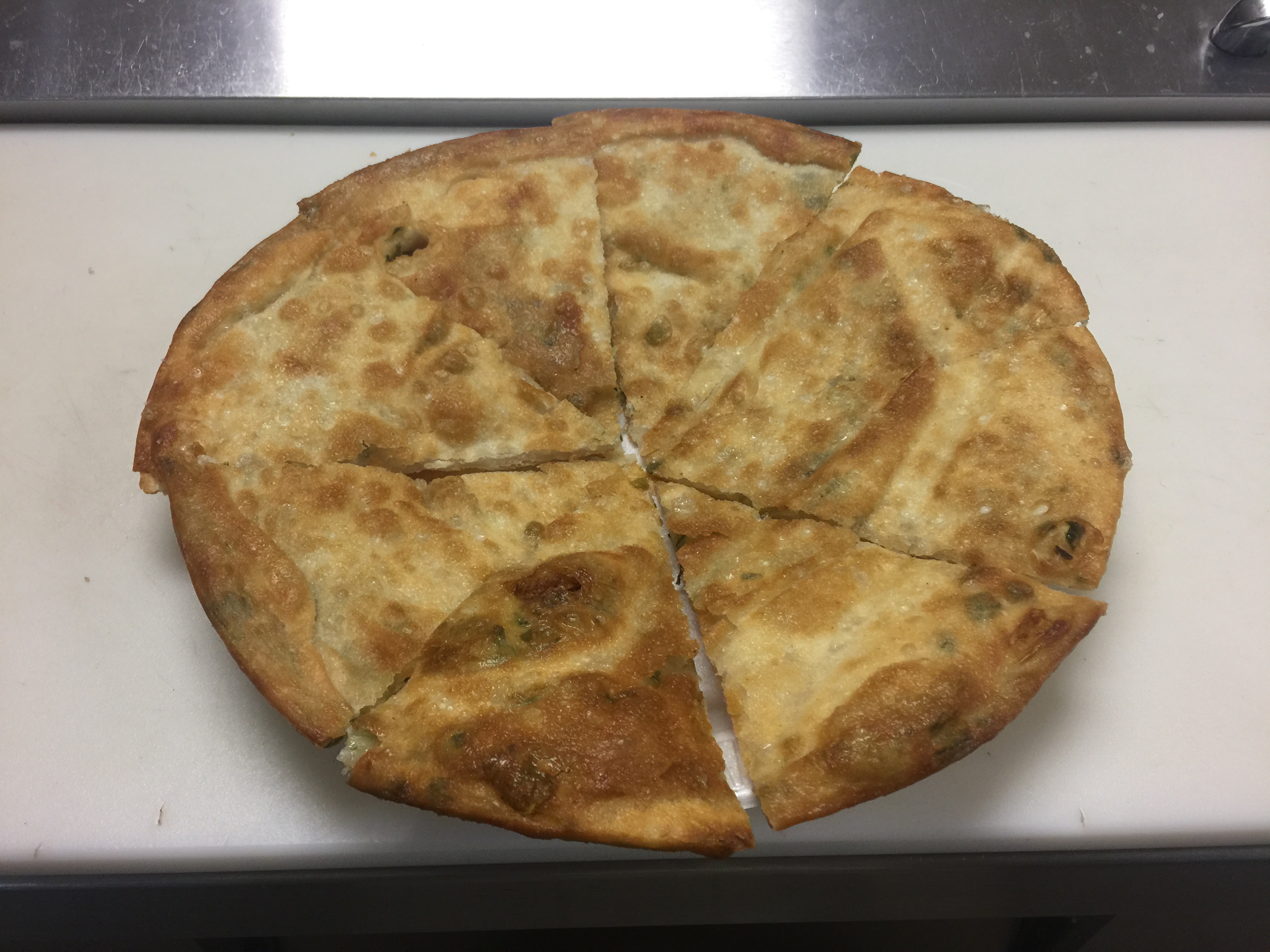 Order A13. Large Scallion Pancake food online from New Hong Kong Village store, Medford on bringmethat.com