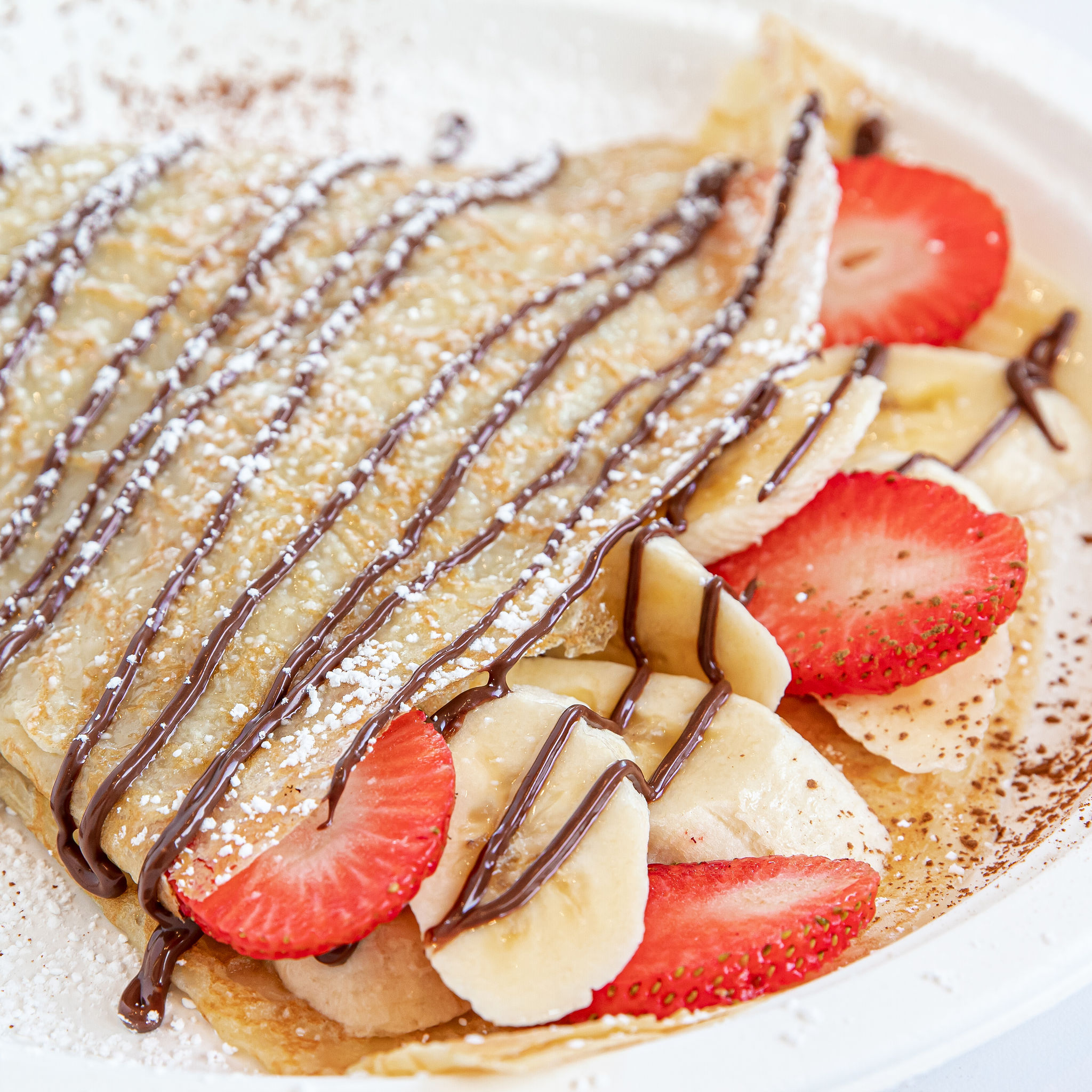 Order Banana Berry Cinnamon Crepe food online from Hazelnuts Creperie store, Charlotte on bringmethat.com