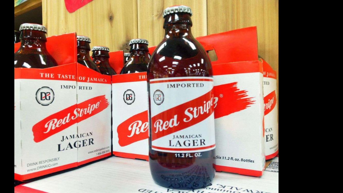 Order Red Stuipe Jamaican Lager 6 Pack food online from New Deli store, New York on bringmethat.com