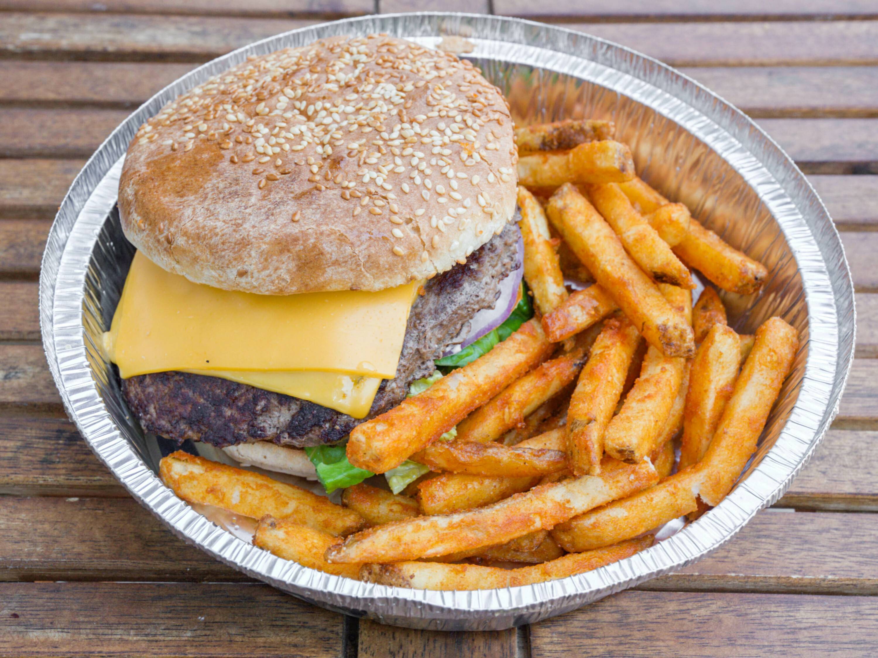 Order Grass fed Cheeseburger 1/2lb beef deluxe food online from OMG Pizza store, Brooklyn on bringmethat.com