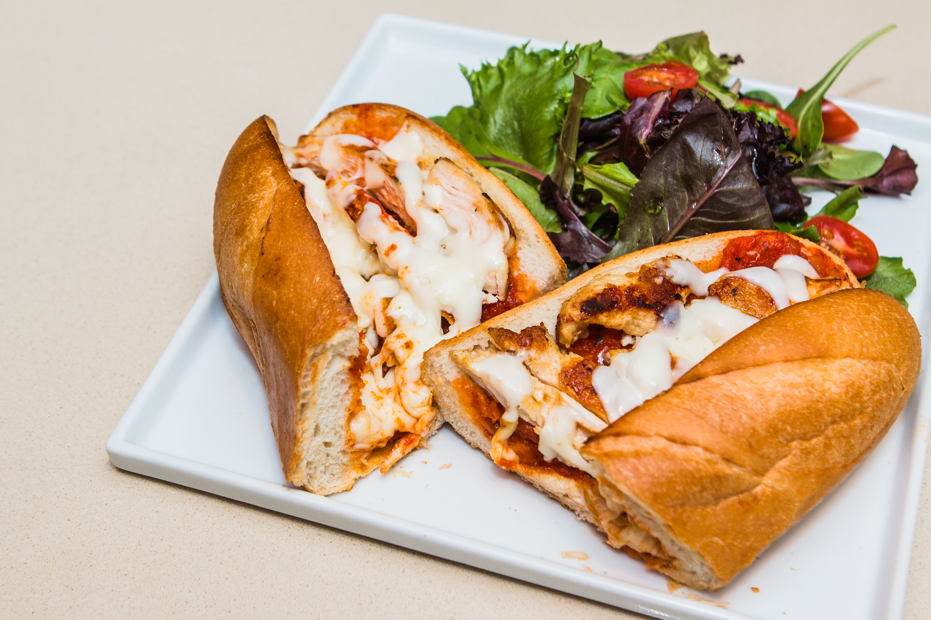 Order Chicken Parmigiana Sandwich food online from Panini Pizza & Italian Kitchen store, West Hollywood on bringmethat.com