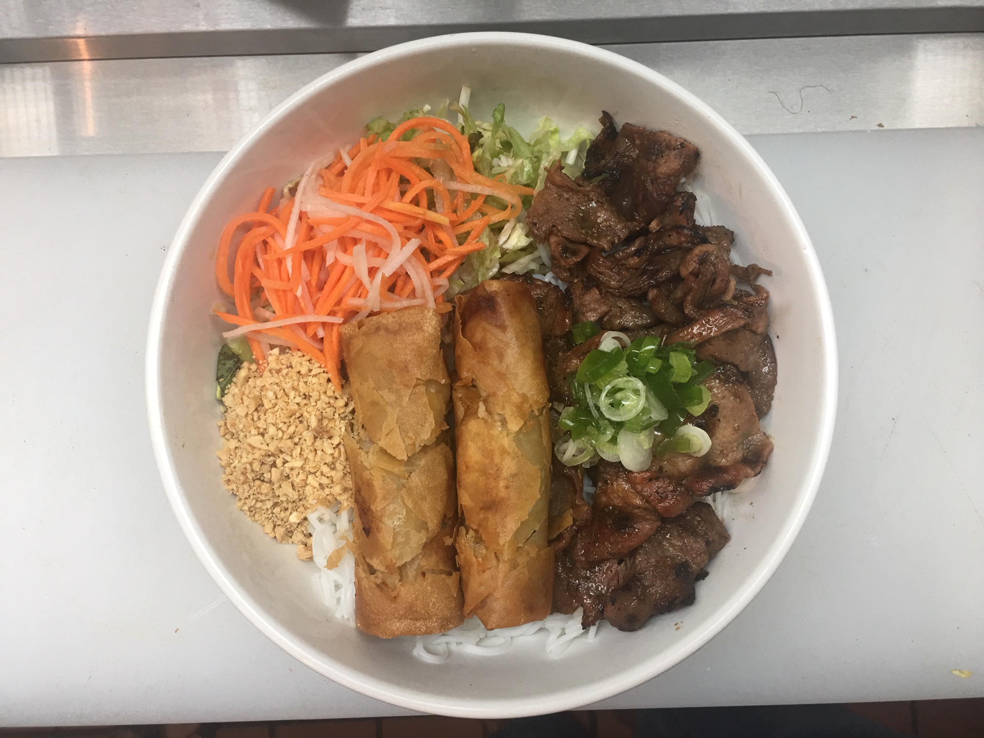 Order 305. Vermicelli with Spring Rolls and Pork food online from Vietnam Kitchen store, Fayetteville on bringmethat.com