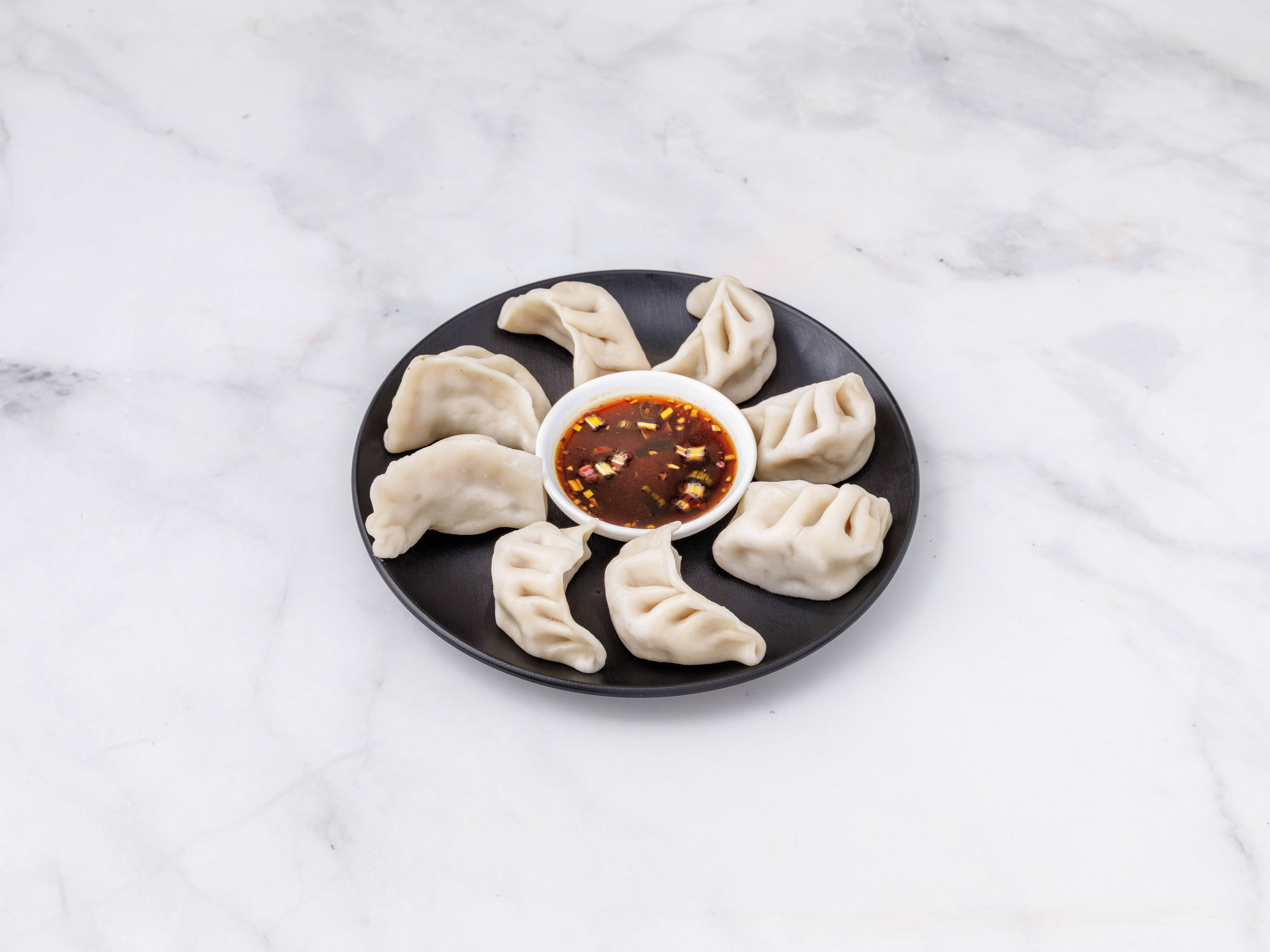Order 8 Piece Steamed Dumplings food online from Yummy Take Out Restaurant store, Atlantic City on bringmethat.com