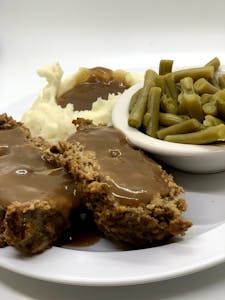 Order OUR HOMEMADE MEATLOAF W/ GRAVY food online from Millers Country Kitchen store, Middletown on bringmethat.com