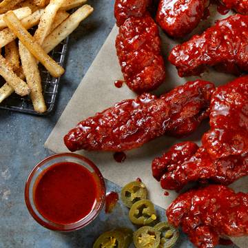 Order 12 Sticky Chicken Fingers food online from Tgi Fridays store, Rockville Centre on bringmethat.com