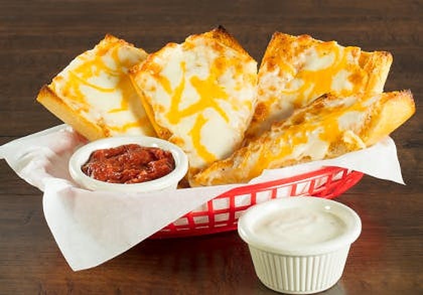 Order Garlic Bread with Cheese - 4 Pieces food online from Mountain Mike Pizza store, Alameda on bringmethat.com