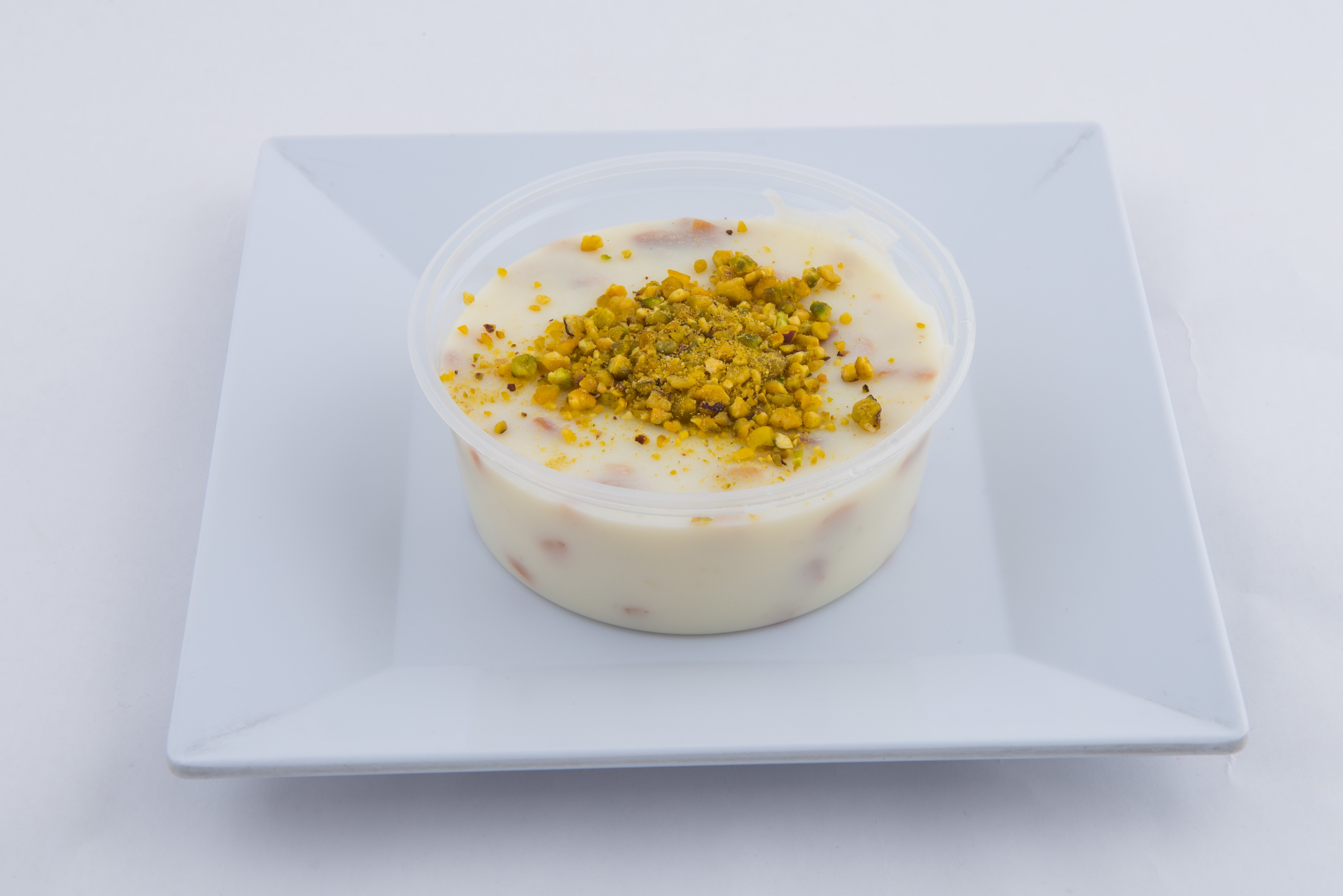 Order Almond Pudding food online from Mangal Kabob  store, Sunnyside on bringmethat.com