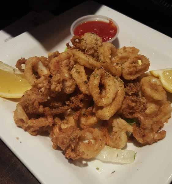 Order Fried Calamari food online from Golden Crust Pizzeria store, Chicago on bringmethat.com