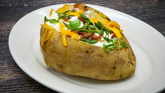 Order Baked Potato food online from Saltgrass Steak House store, Houston on bringmethat.com