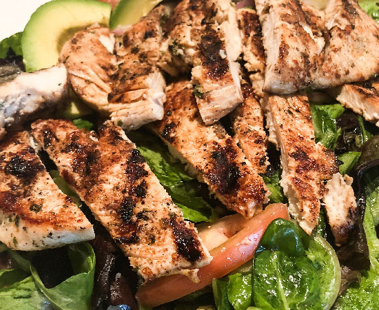 Order Mixed Green and Avocado Salad with Grilled Chicken food online from Coach House Diner Restaurant store, North Bergen on bringmethat.com