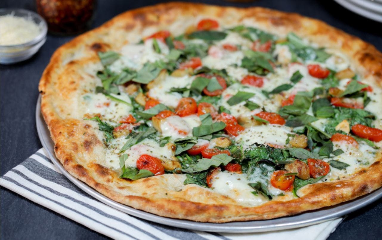 Order Neapolitan Spinacini Pizza - 10'' food online from Patxi's Chicago Pizza store, San Francisco on bringmethat.com