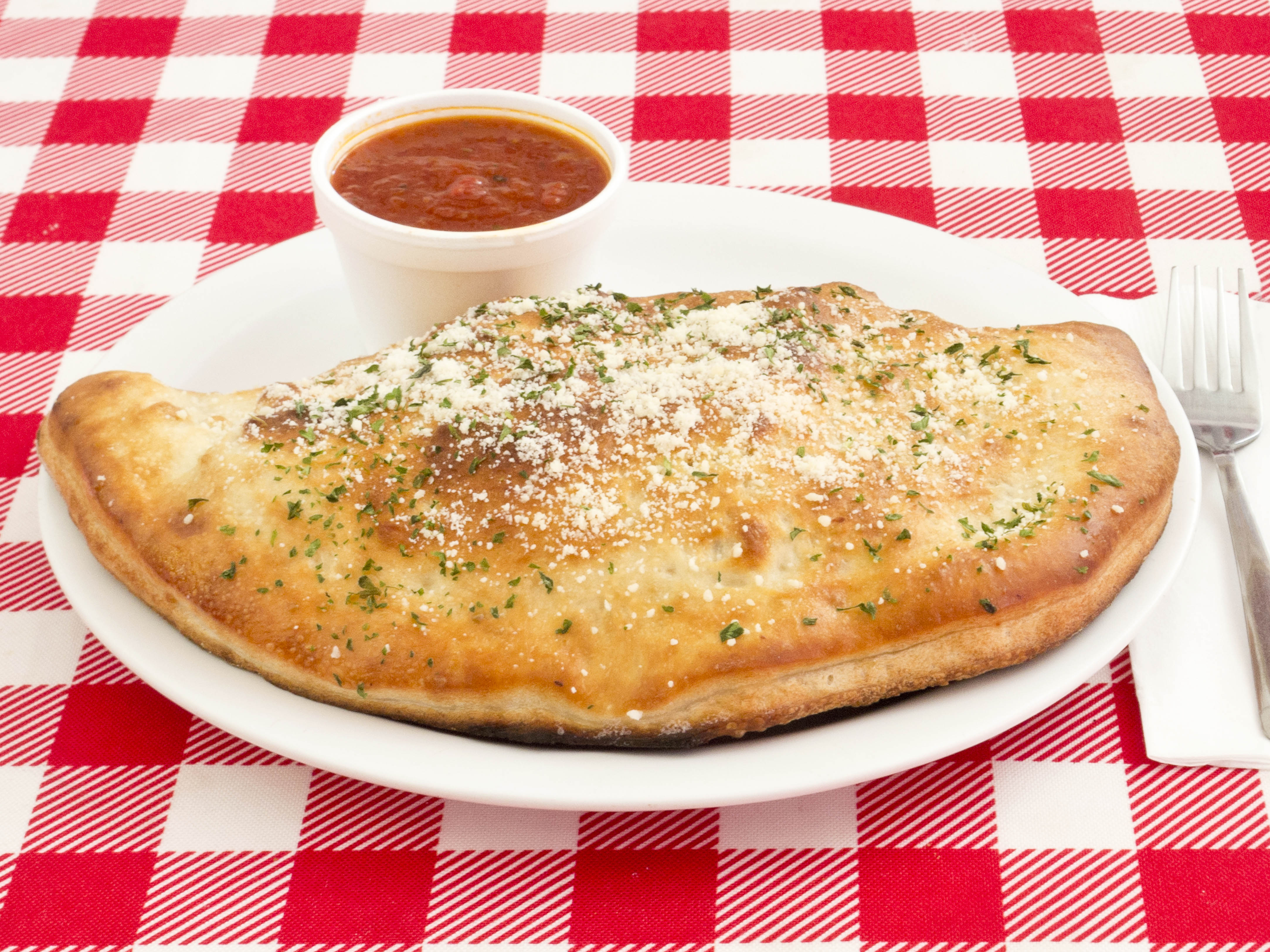 Order Mozzarella, Pepperoni, Sausage and Mushroom Stromboli food online from Divino's Pizza store, Dallas on bringmethat.com