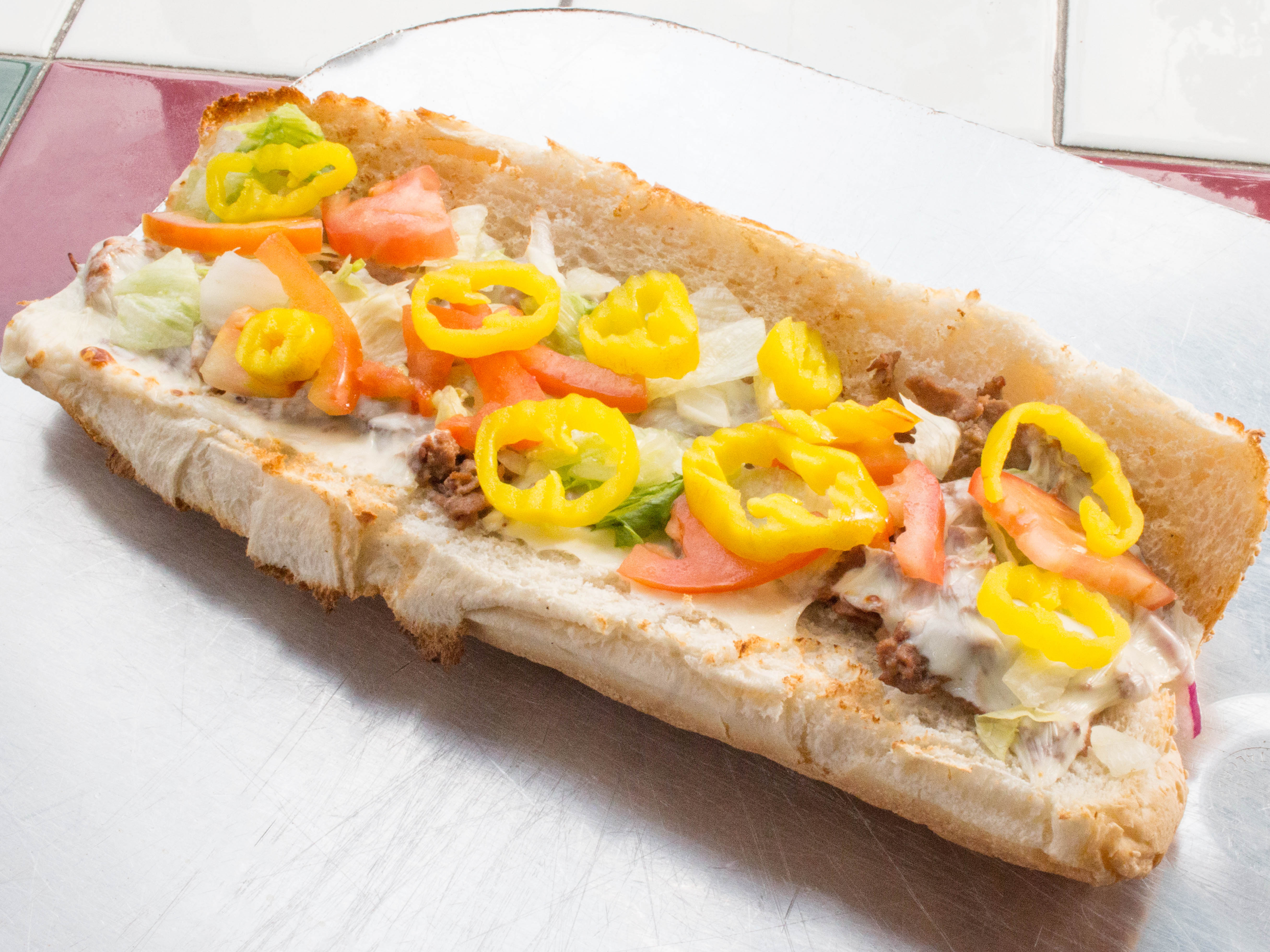 Order Oven-Baked Italian Sub food online from Amiccis Pizza store, Detroit on bringmethat.com