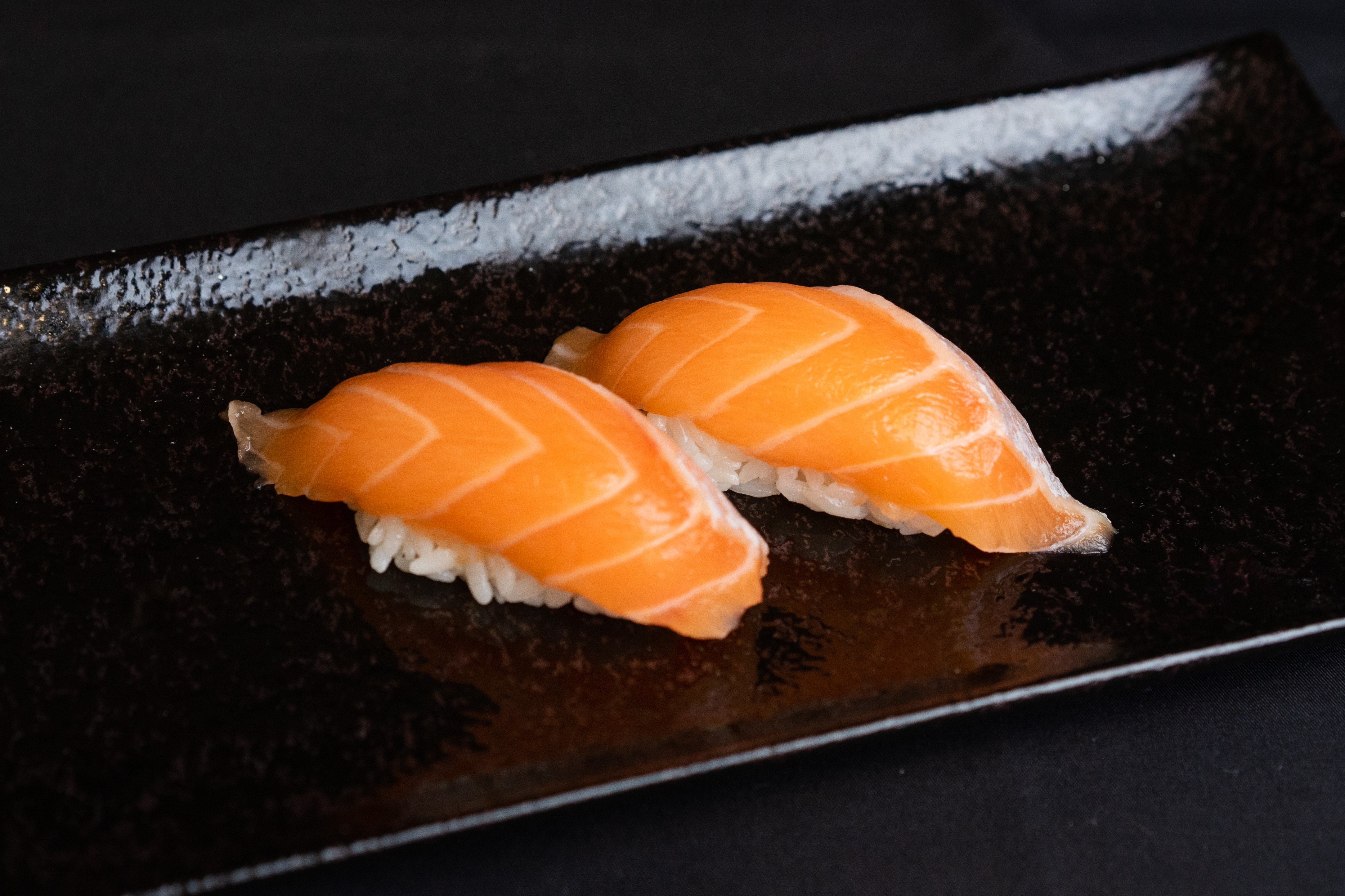 Order Salmon Nigiri food online from O Maki Rolls + Teriyaki store, Seattle on bringmethat.com